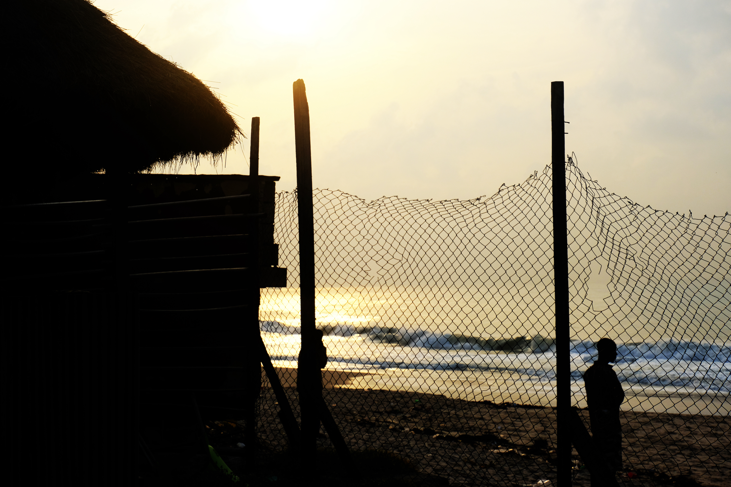 the sea behind a wire fence in lagos