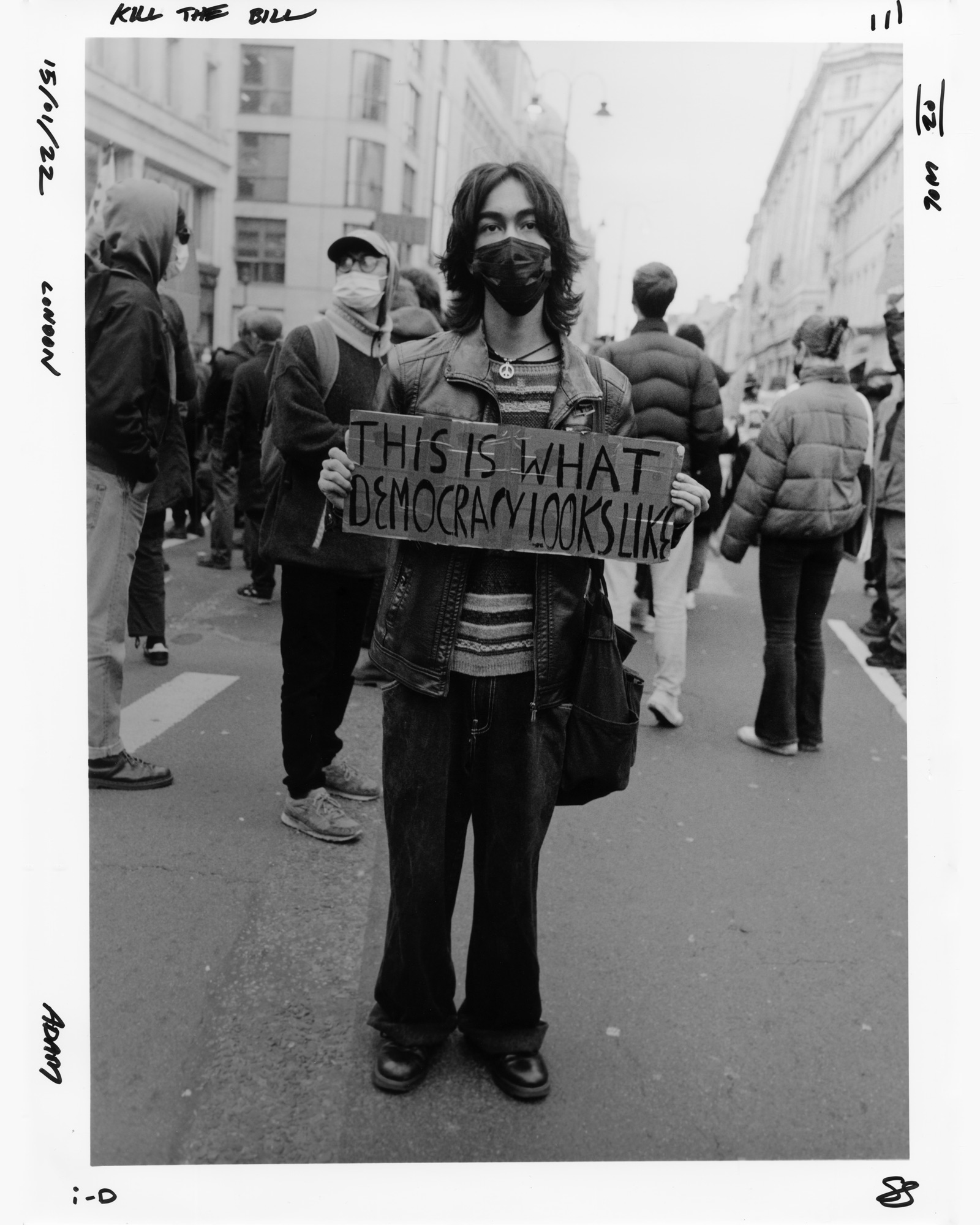 Protester holding a sign saying