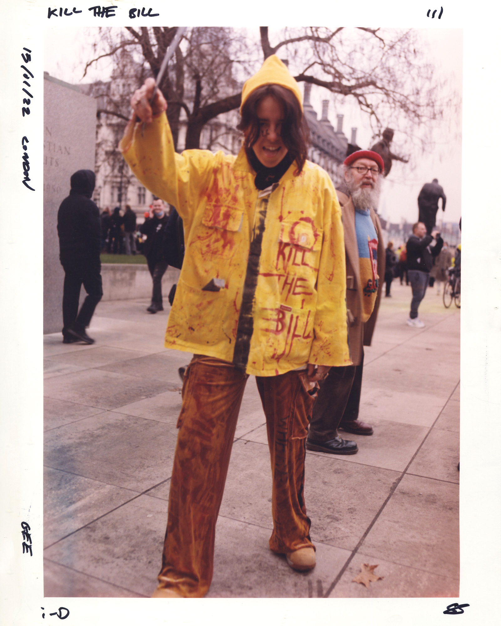Protester in a yellow coat with