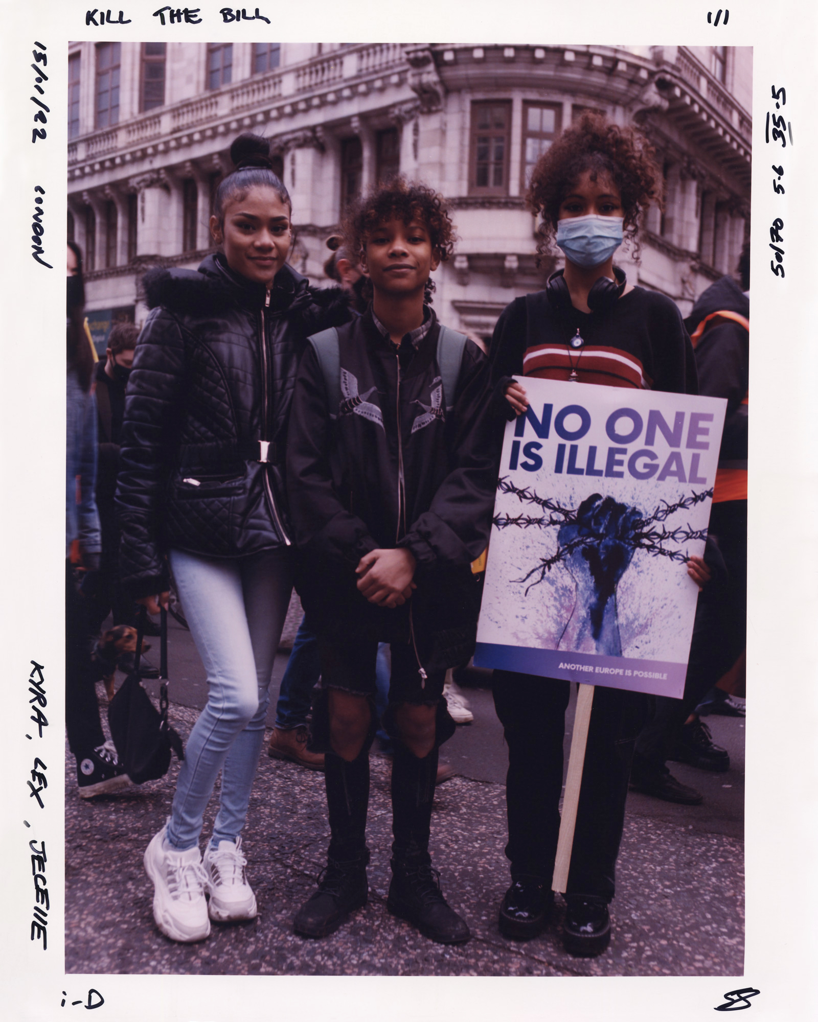 Three protesters at the Kill the Bill protest, one holding a sign saying