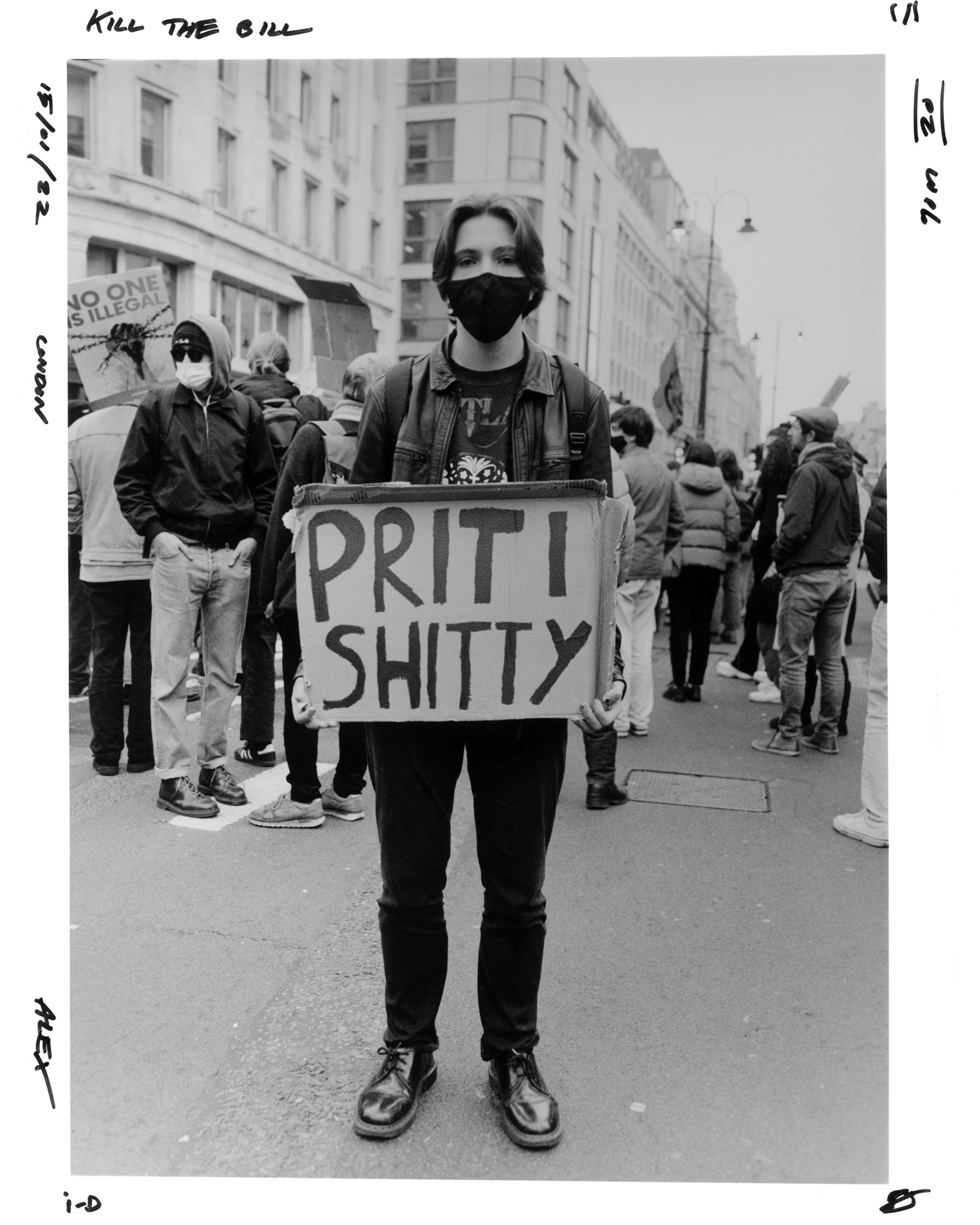 Protester holding a sign saying
