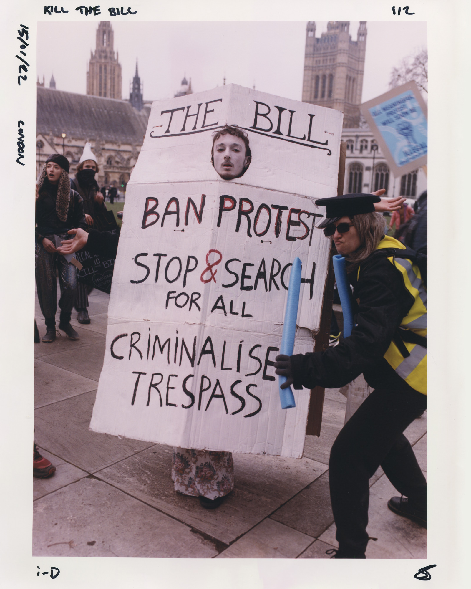 Protester wearing a sign saying