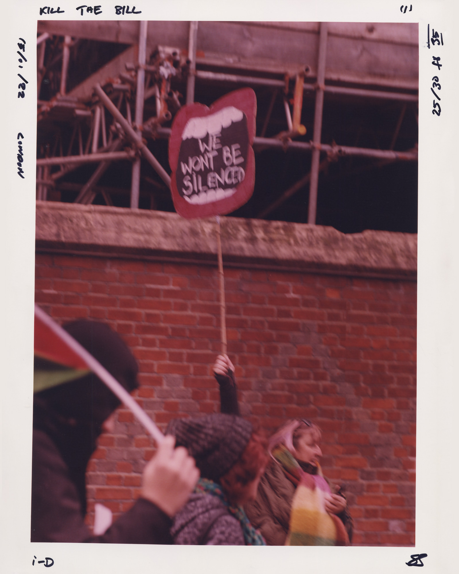 Protester holding a sign saying