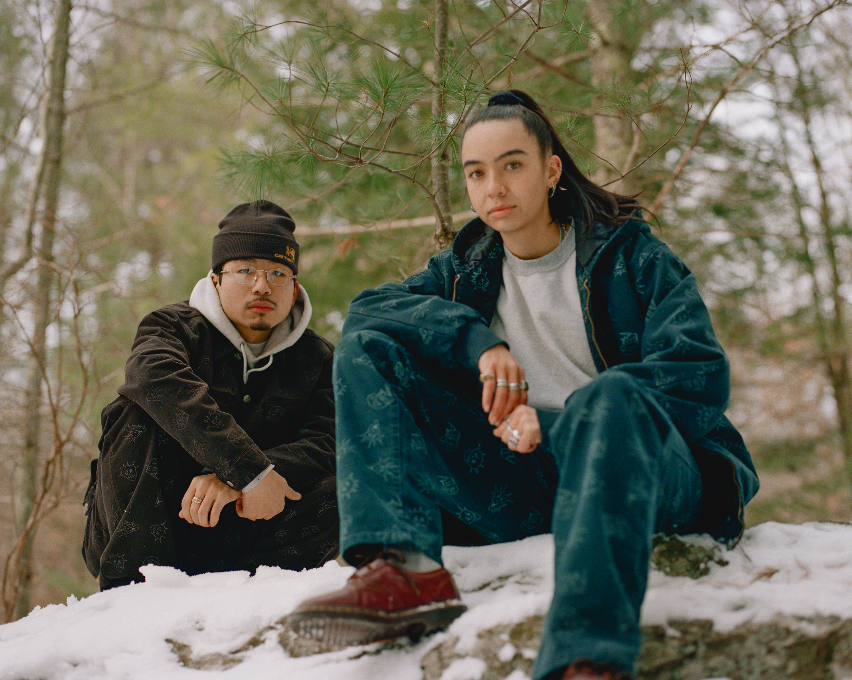 models wearing the stray rats and carhartt wip collab in the snow