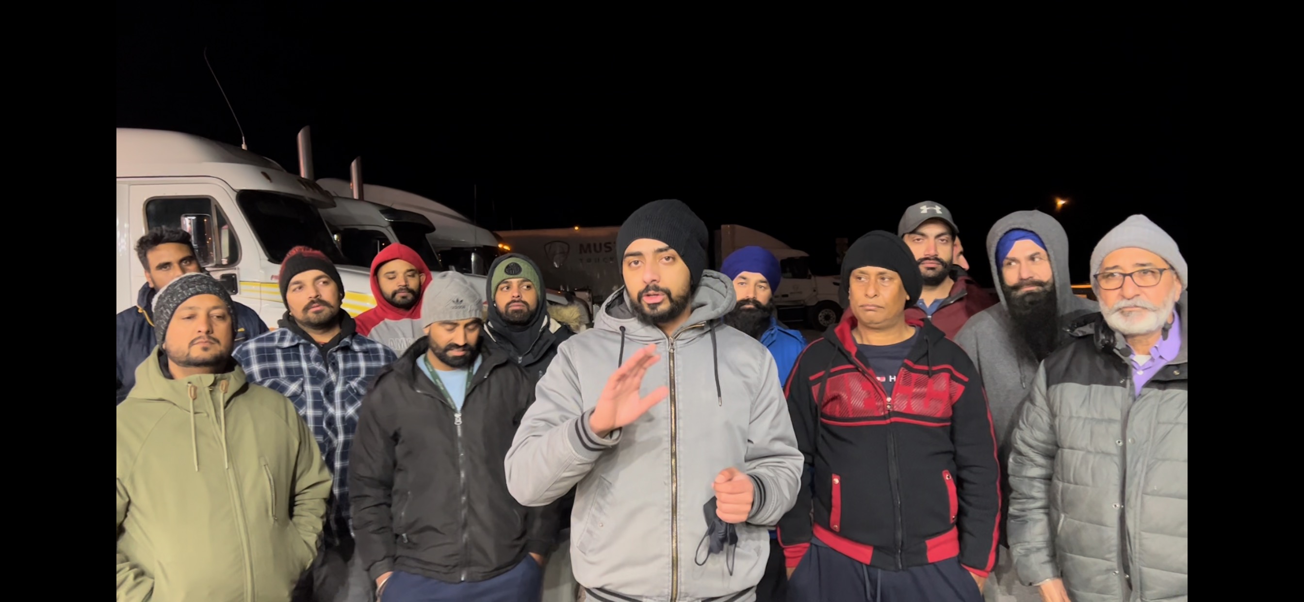 Lovepreet Singh in the middle voicing concerns about anti-vax convoy on Facebook