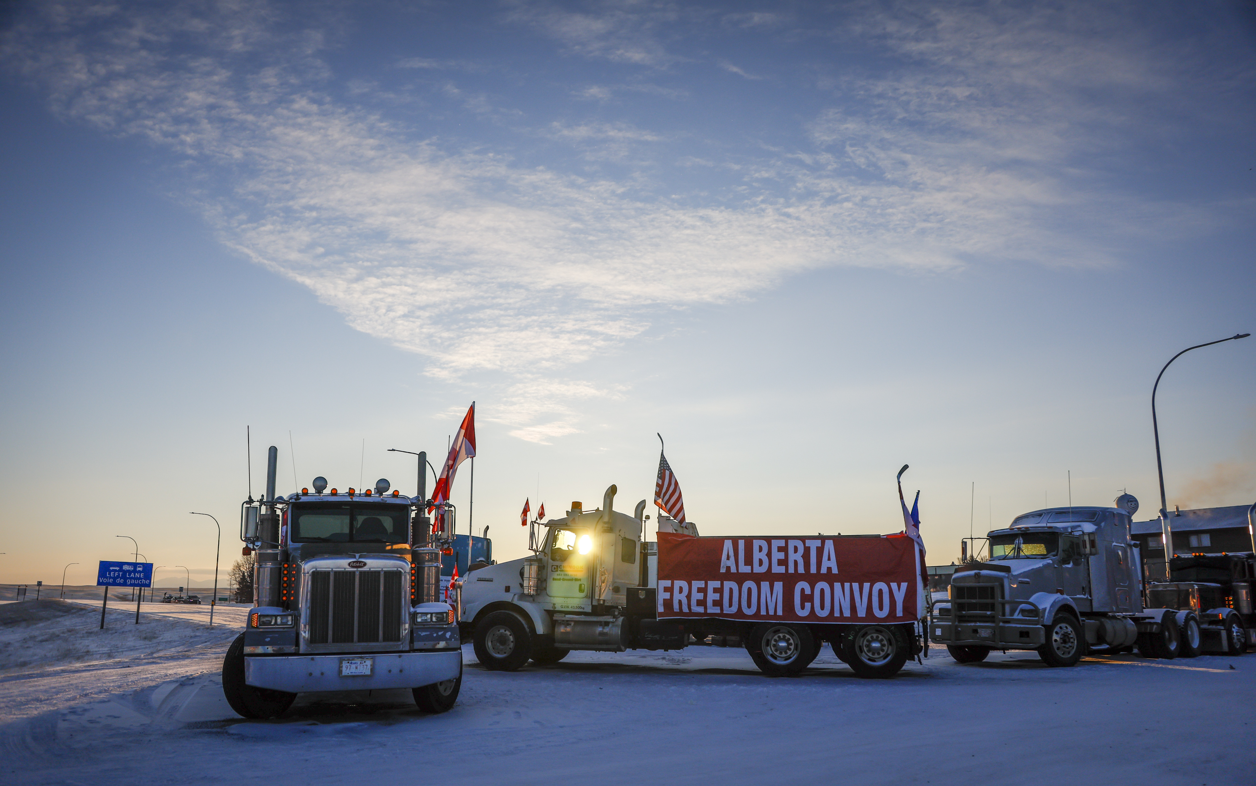 Anti-vax truckers continue to block the highway at the busy U.S. border crossing in Coutts, Alberta, Wednesday. Photo by THE CANADIAN PRESS/Jeff McIntosh  