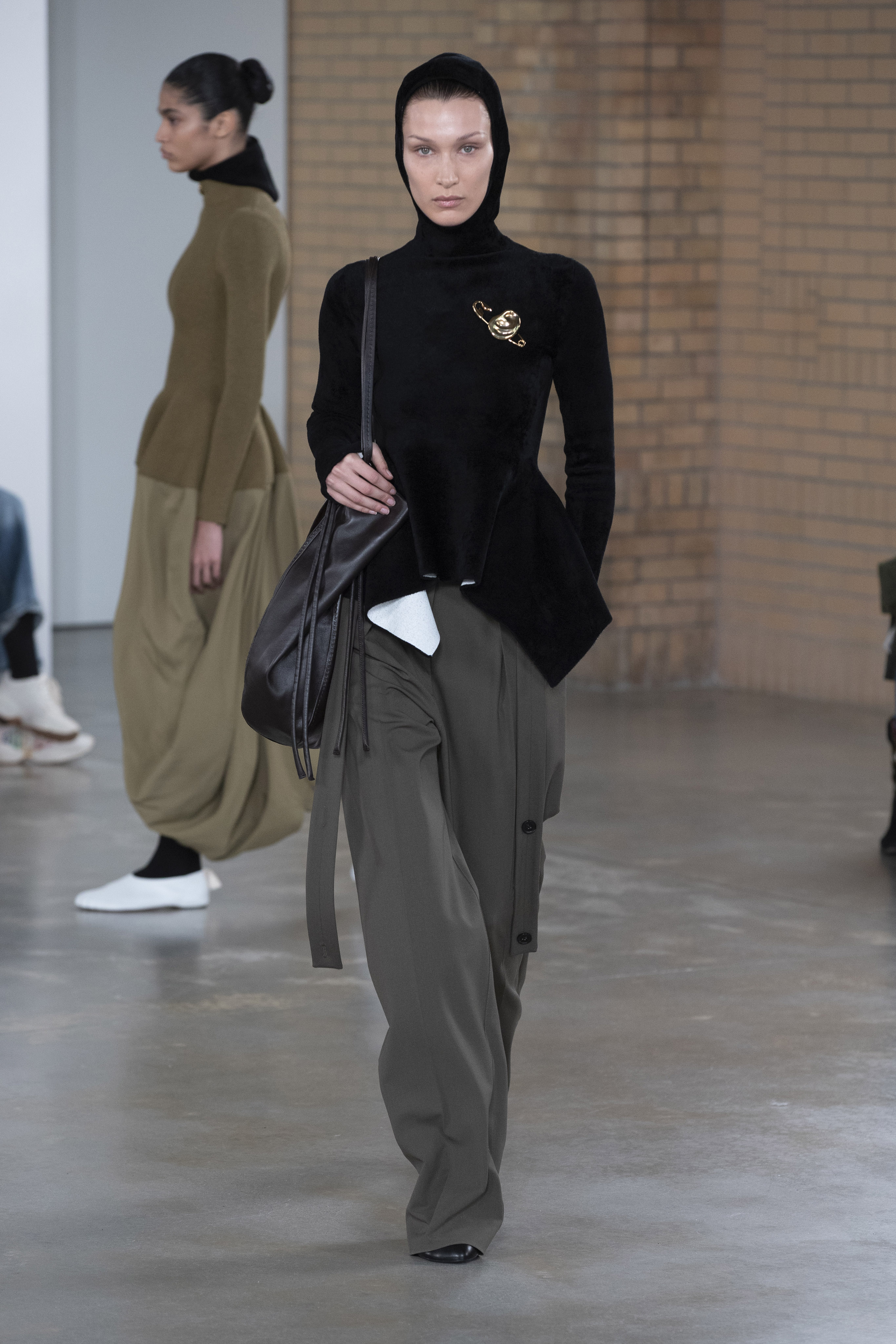 a model wearing proenza schouler's aw22 collection