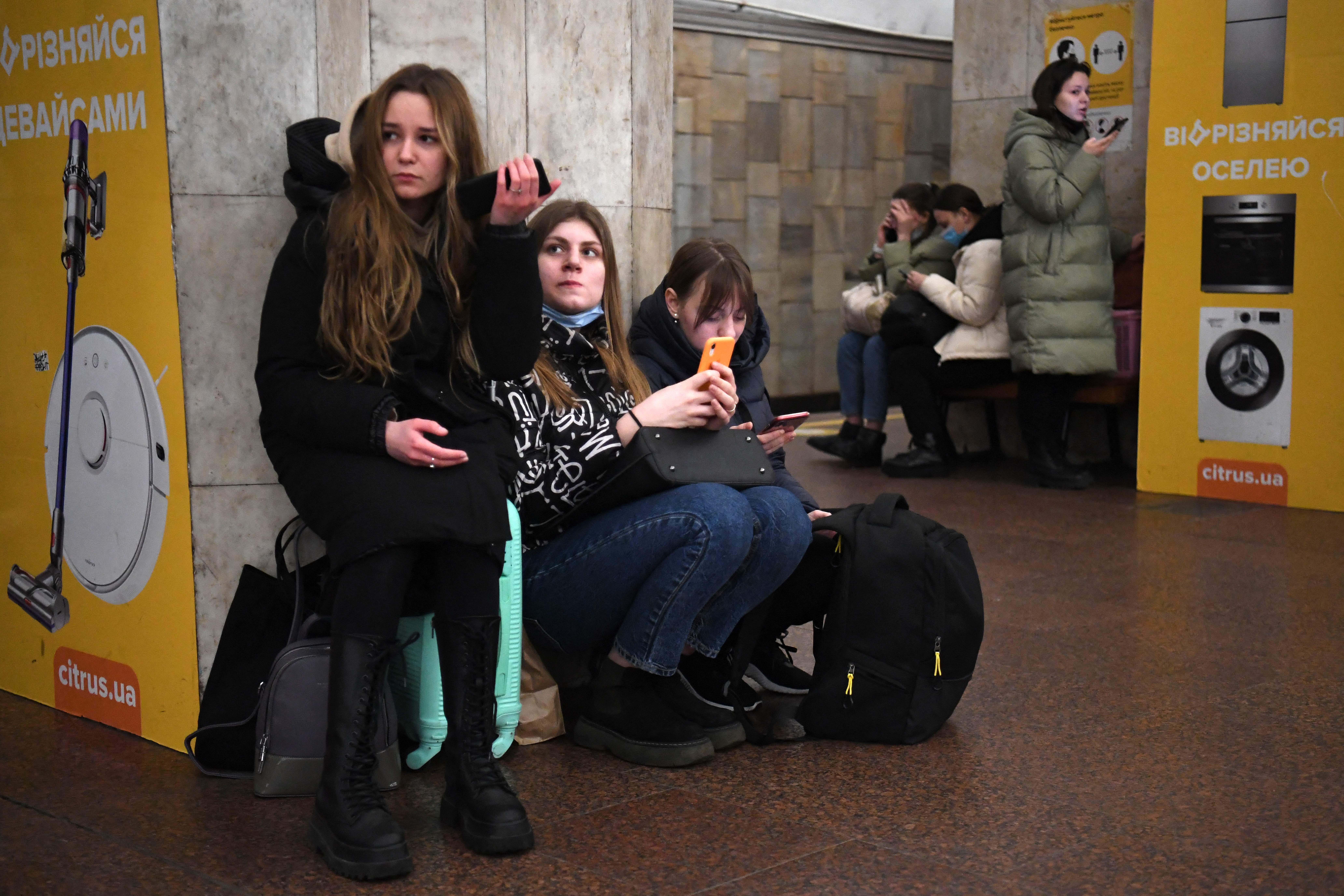 People take refuge in a metro station in Kyiv on Thursday morning. Photo: DANIEL LEAL/AFP via Getty Images