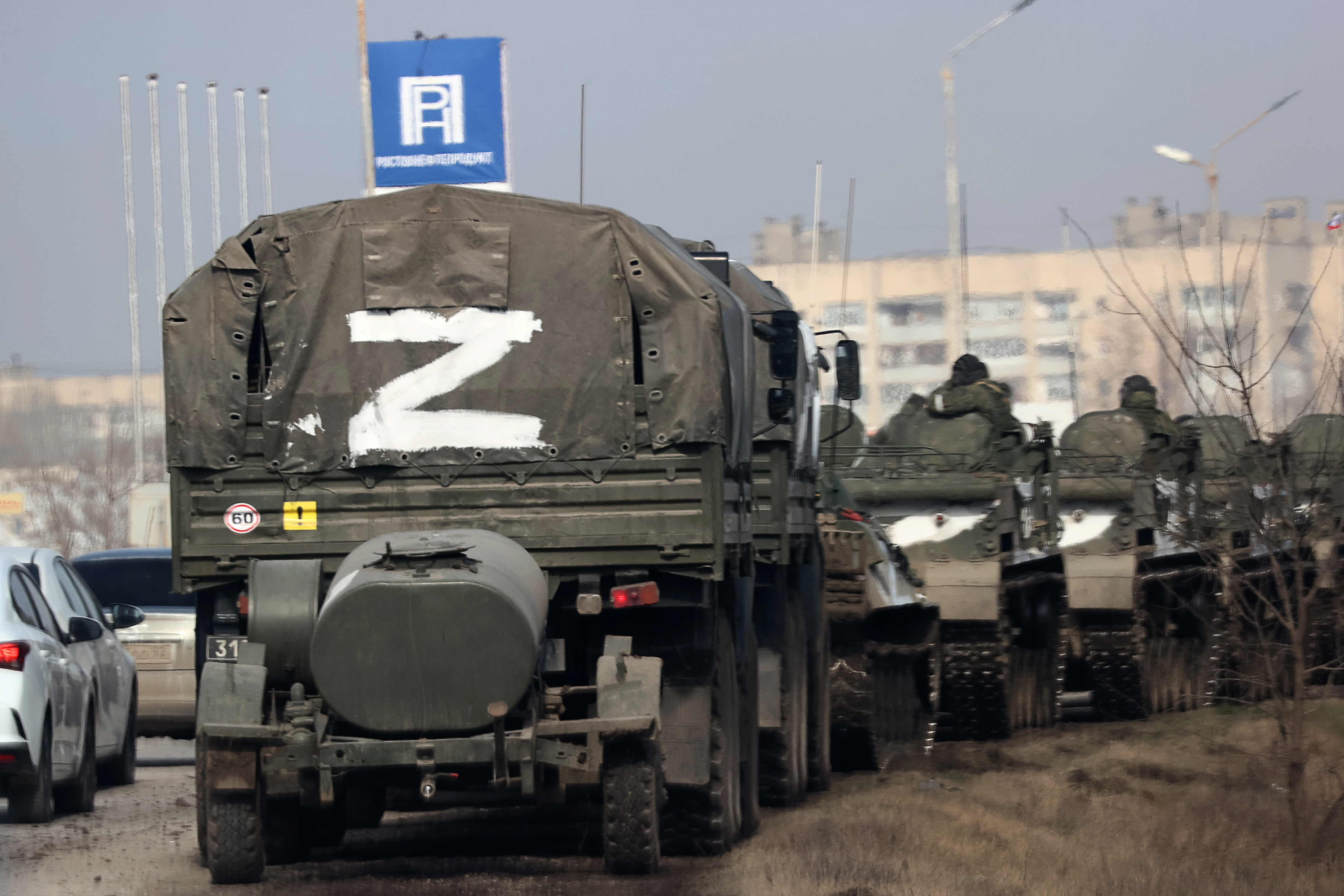 A column of army trucks moves across the town of Armyansk, northern Crimea.