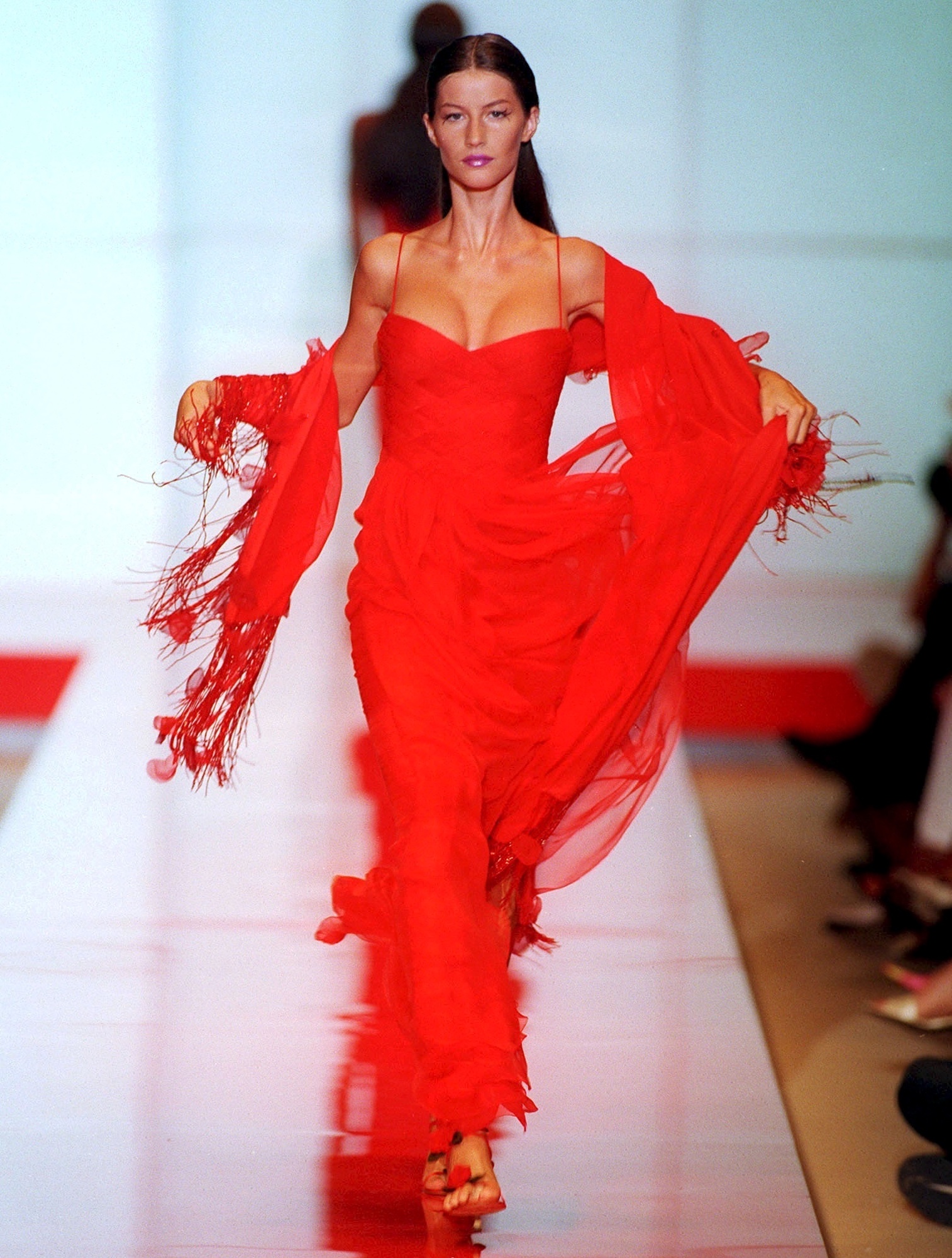 Gisele Bünchen walking for Valentino Haute Couture AW99-00 show in a red dress