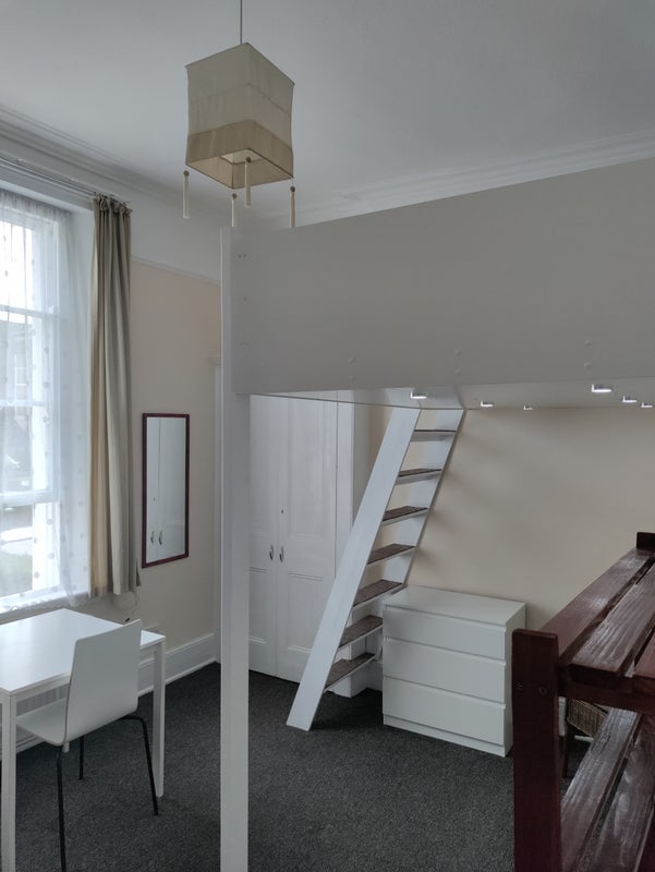 A one-bed bedsit in Crouch End with the staircase cut into a wardrobe