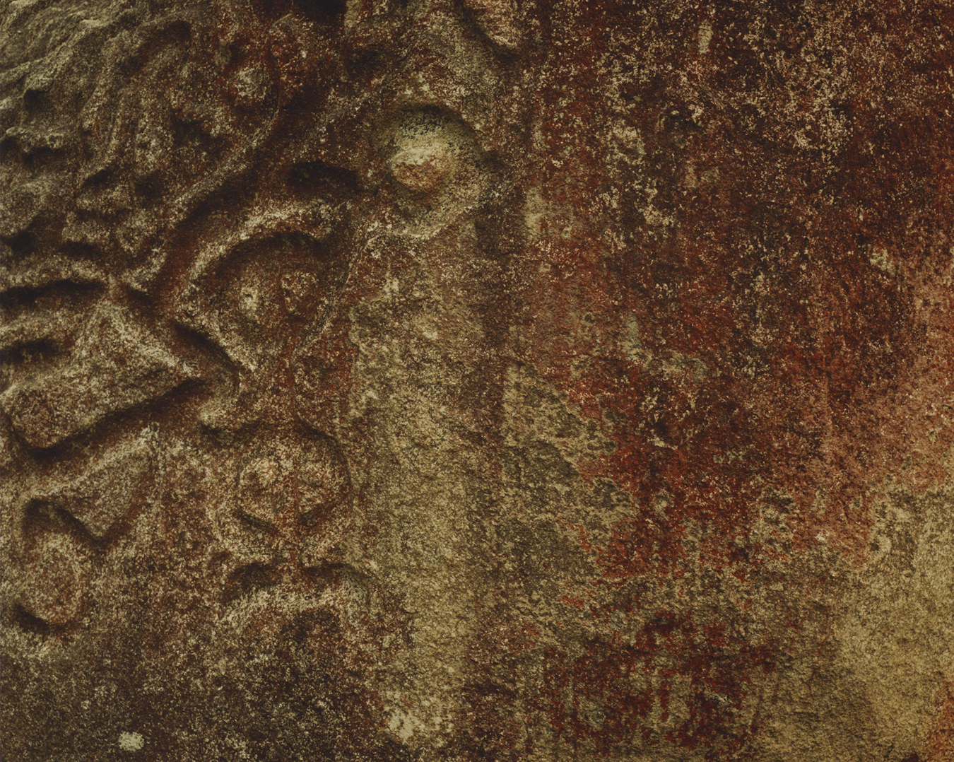 A rock with an indigenous print carved into it