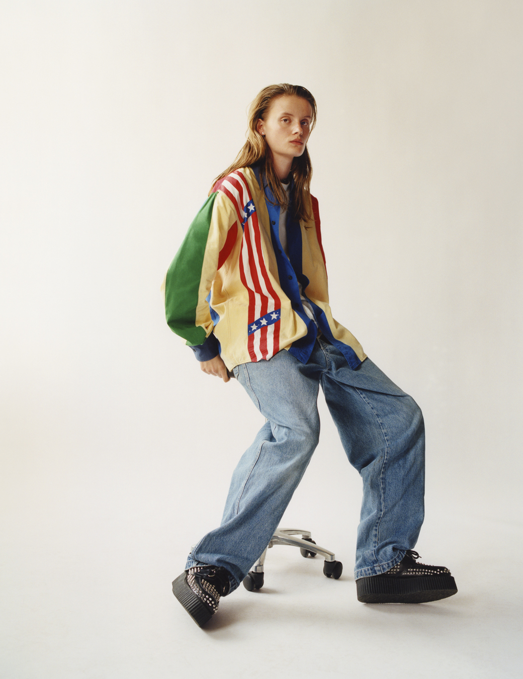 Model sitting in a shirt and jeans with ID 369 Earthrise case