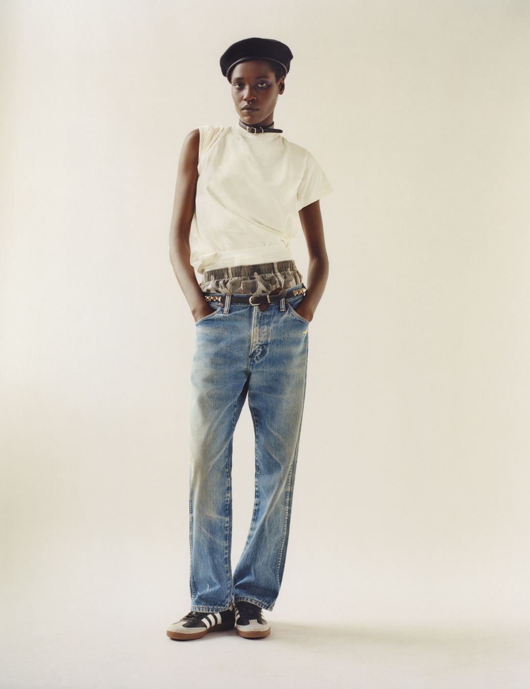 model wearing a white top, boxers, blue jeans and trainers  in i-D 369 the Earthrise issue