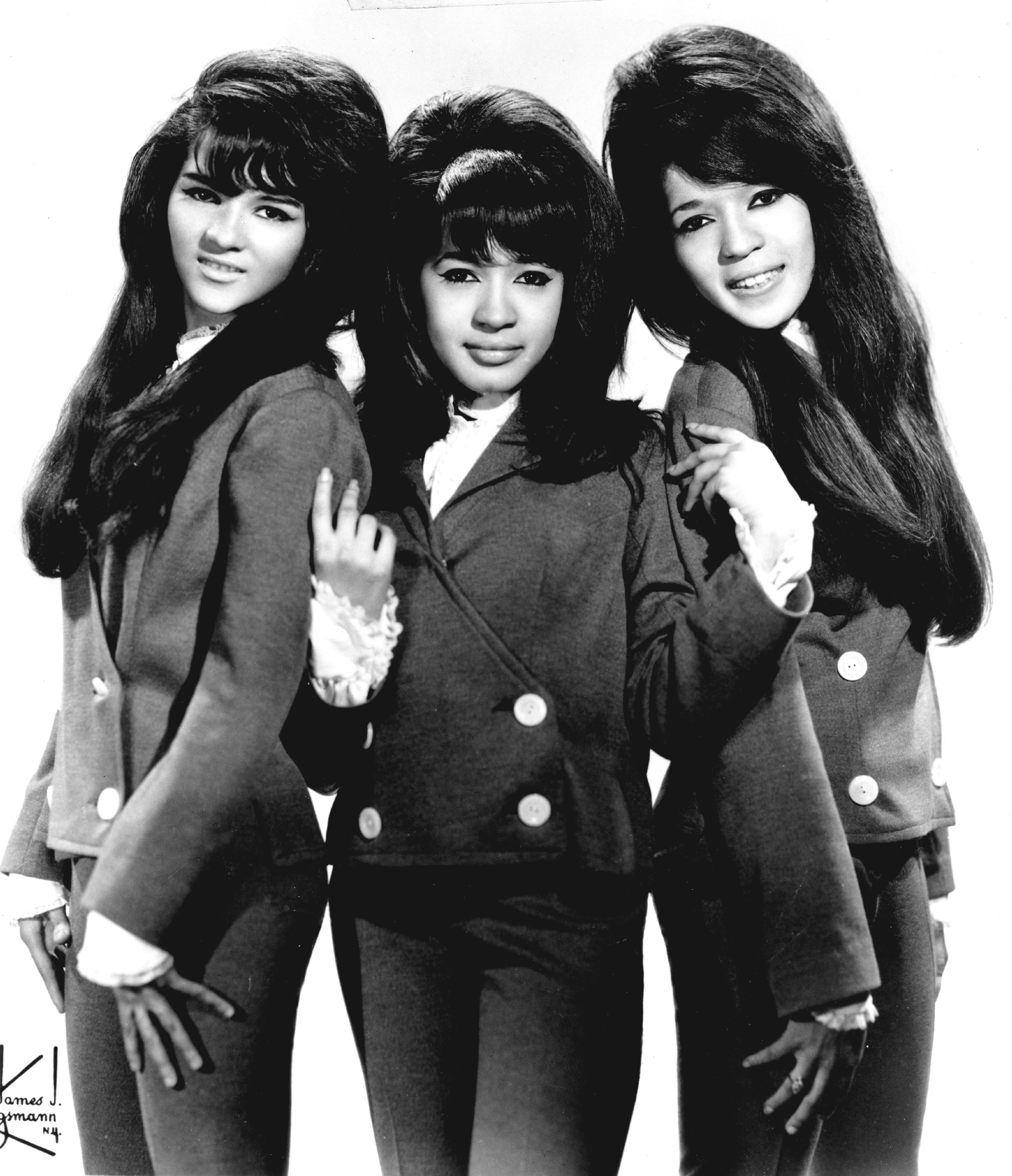 the ronnettes posing in matching mod pantsuits in 1963