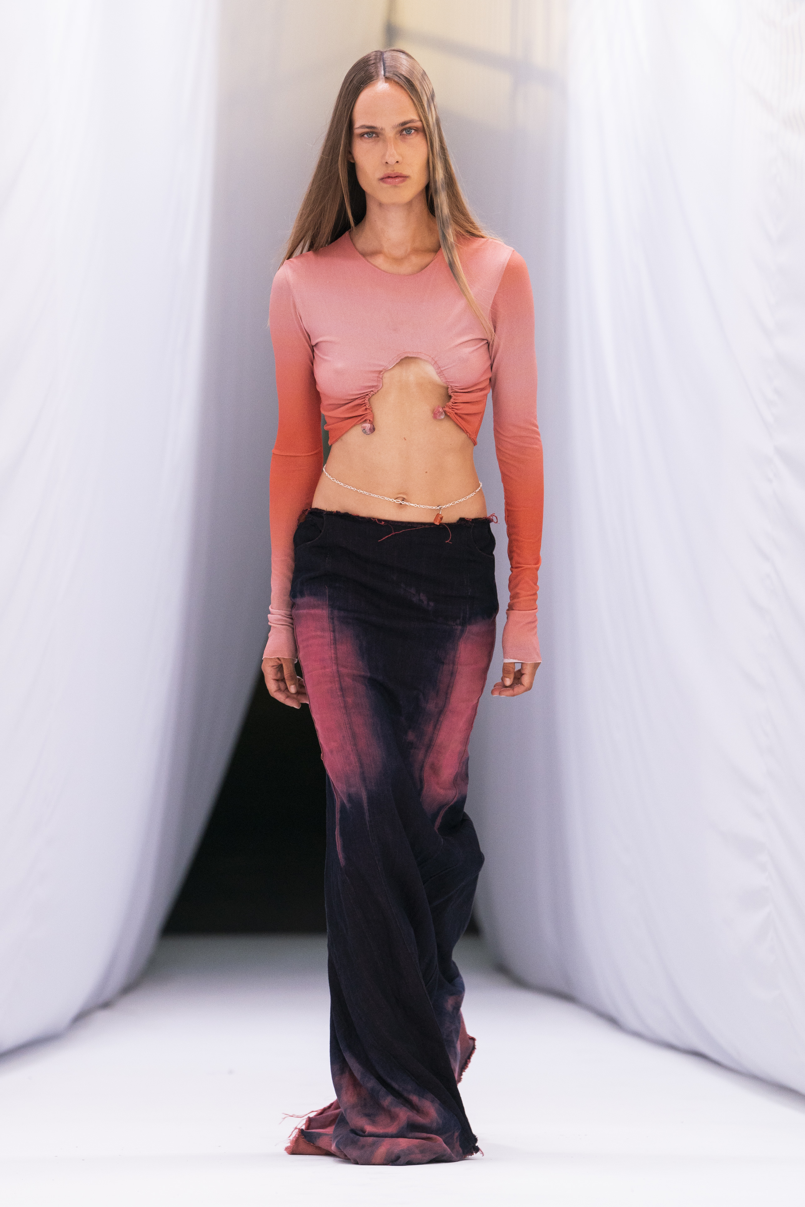 A model walking Jade Cropper SS23