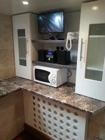 The microwave in a double mezzanine studio to rent in Vaxuhall, London