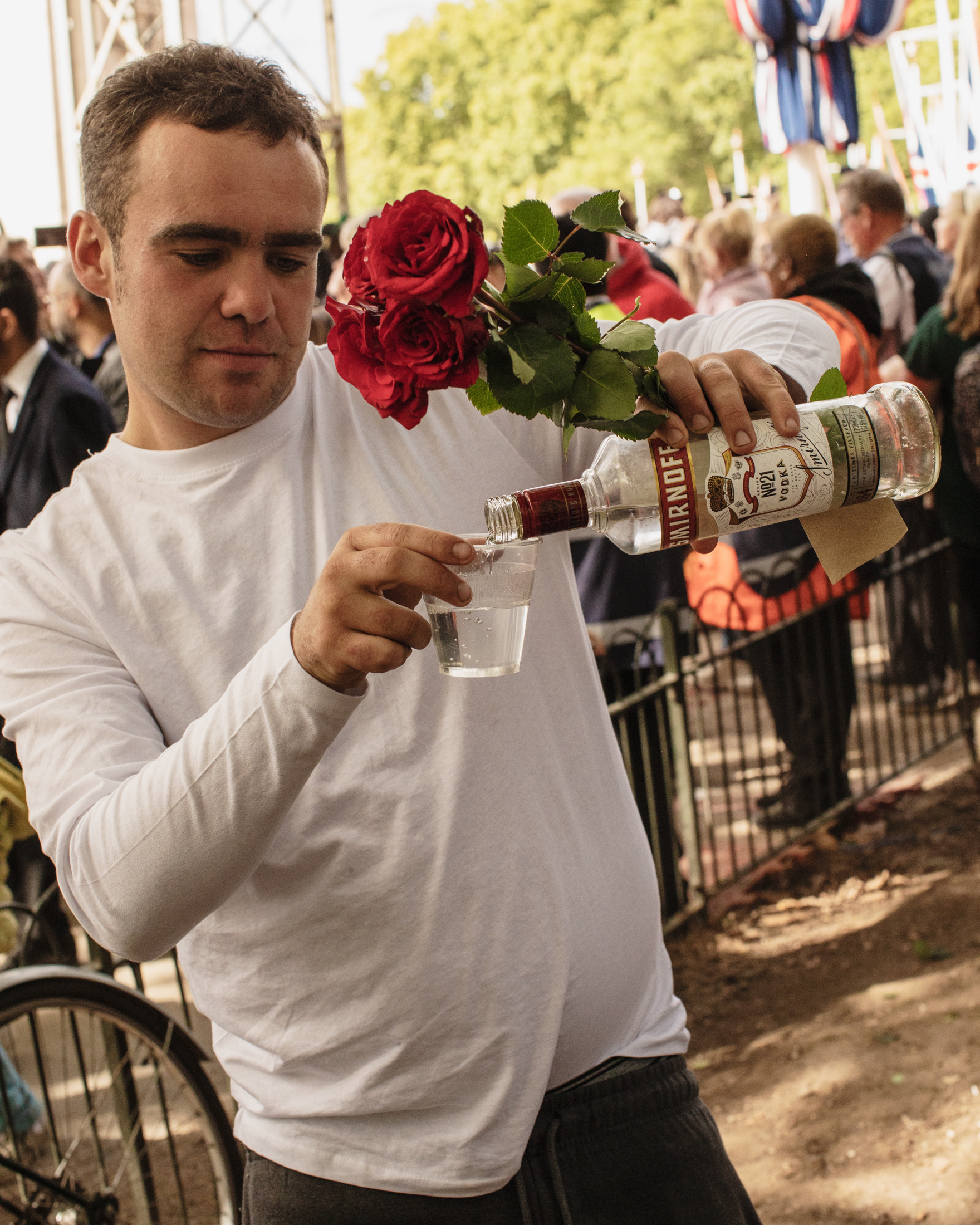 Man pouring vodka during Queen Elizabeth II's funeral