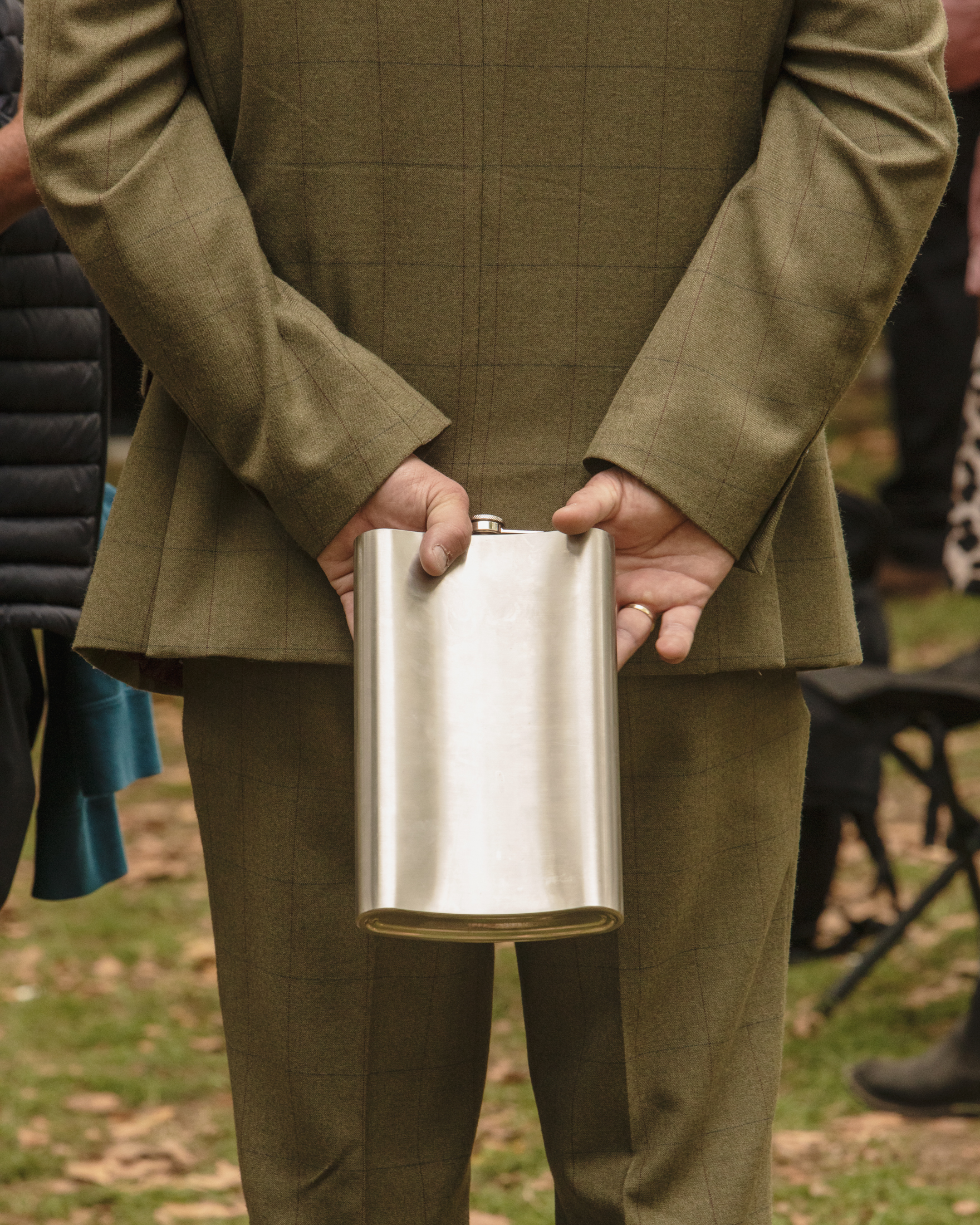 Man holding giant alcohol flask during Queen Elizabeth II's funeral