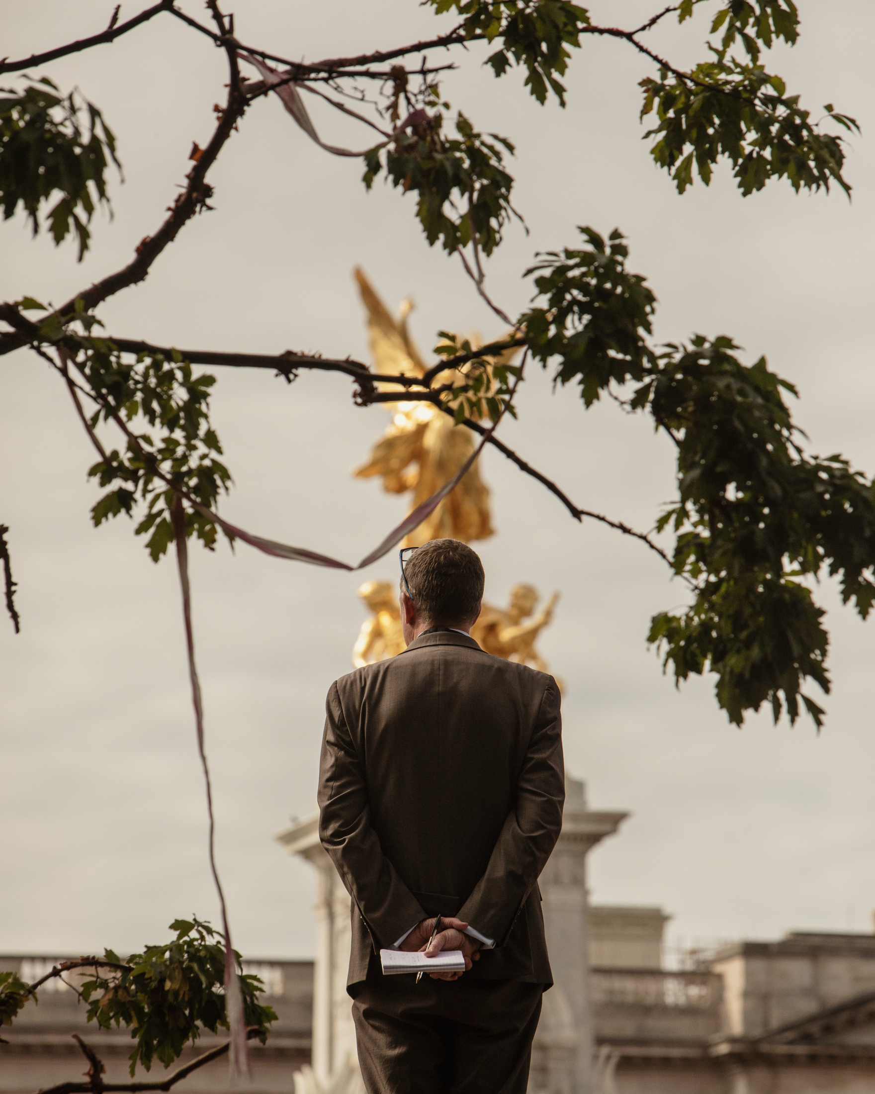 Man looking towards Victoria Memorial during Queen Elizabeth II's funeral