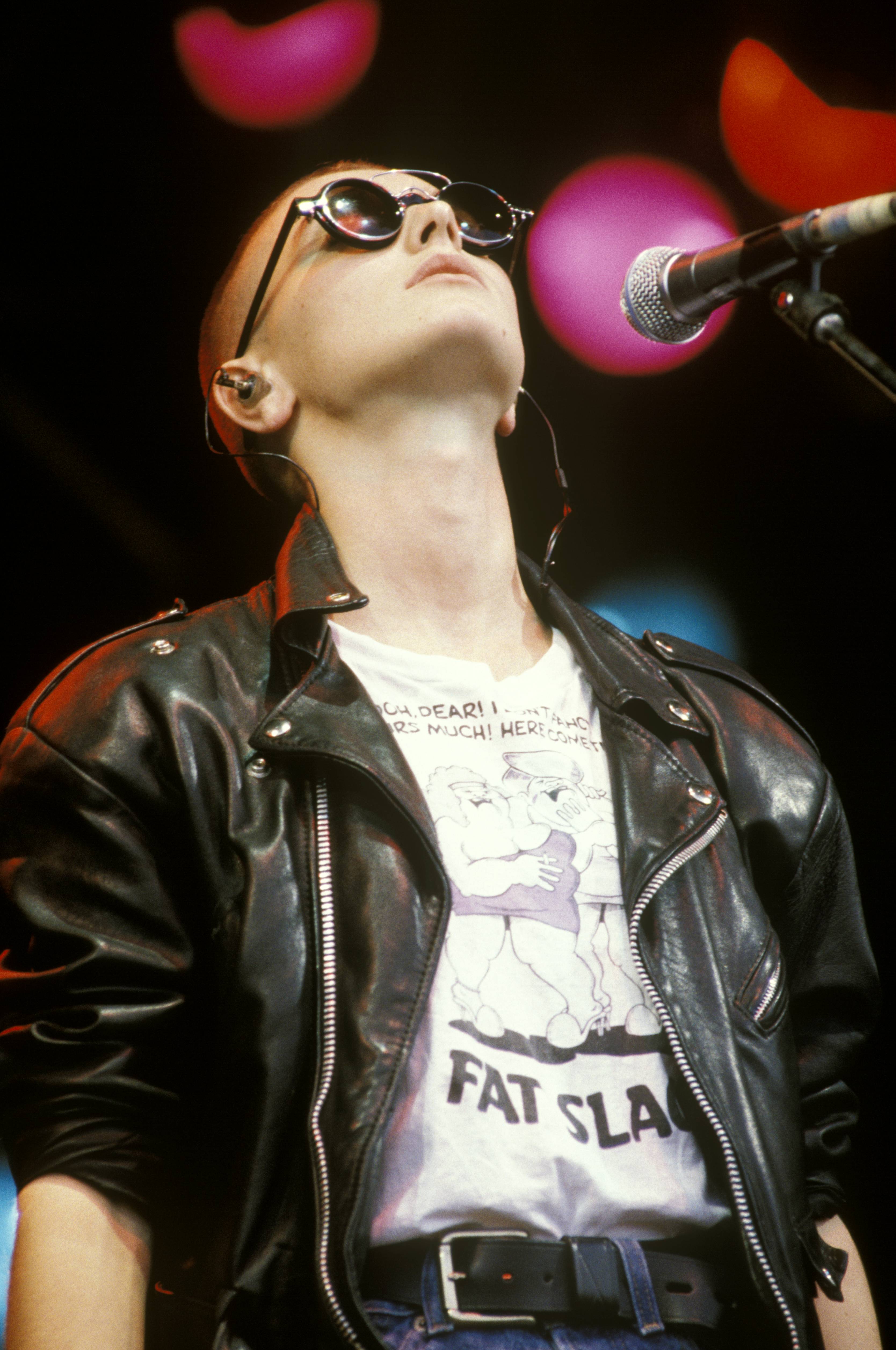 Sinead O'Connor in white t-shirt and black leather jacket at Glastonbury 1990