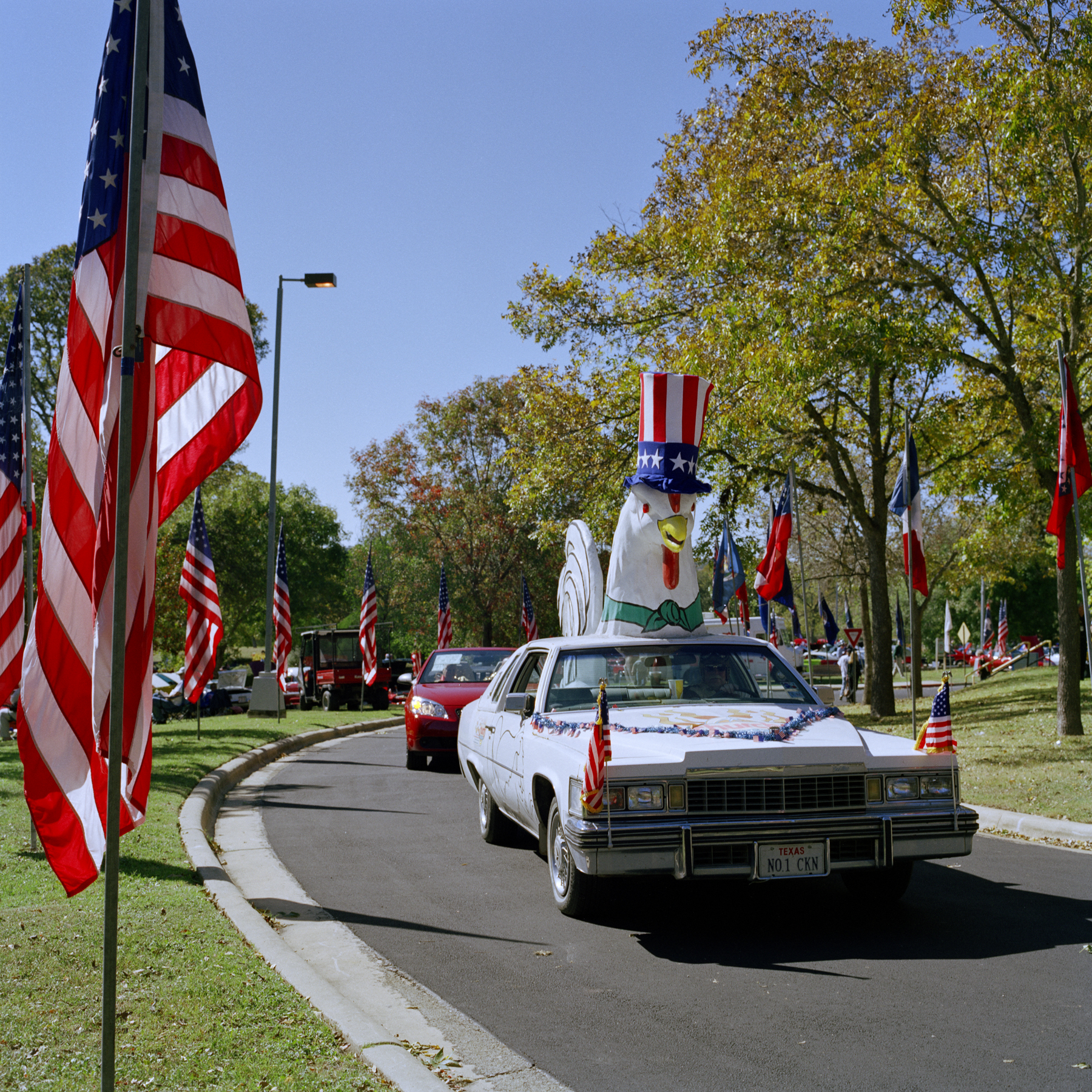 Cars as part of a veteran's parade in Texas in the mid-2000s. 