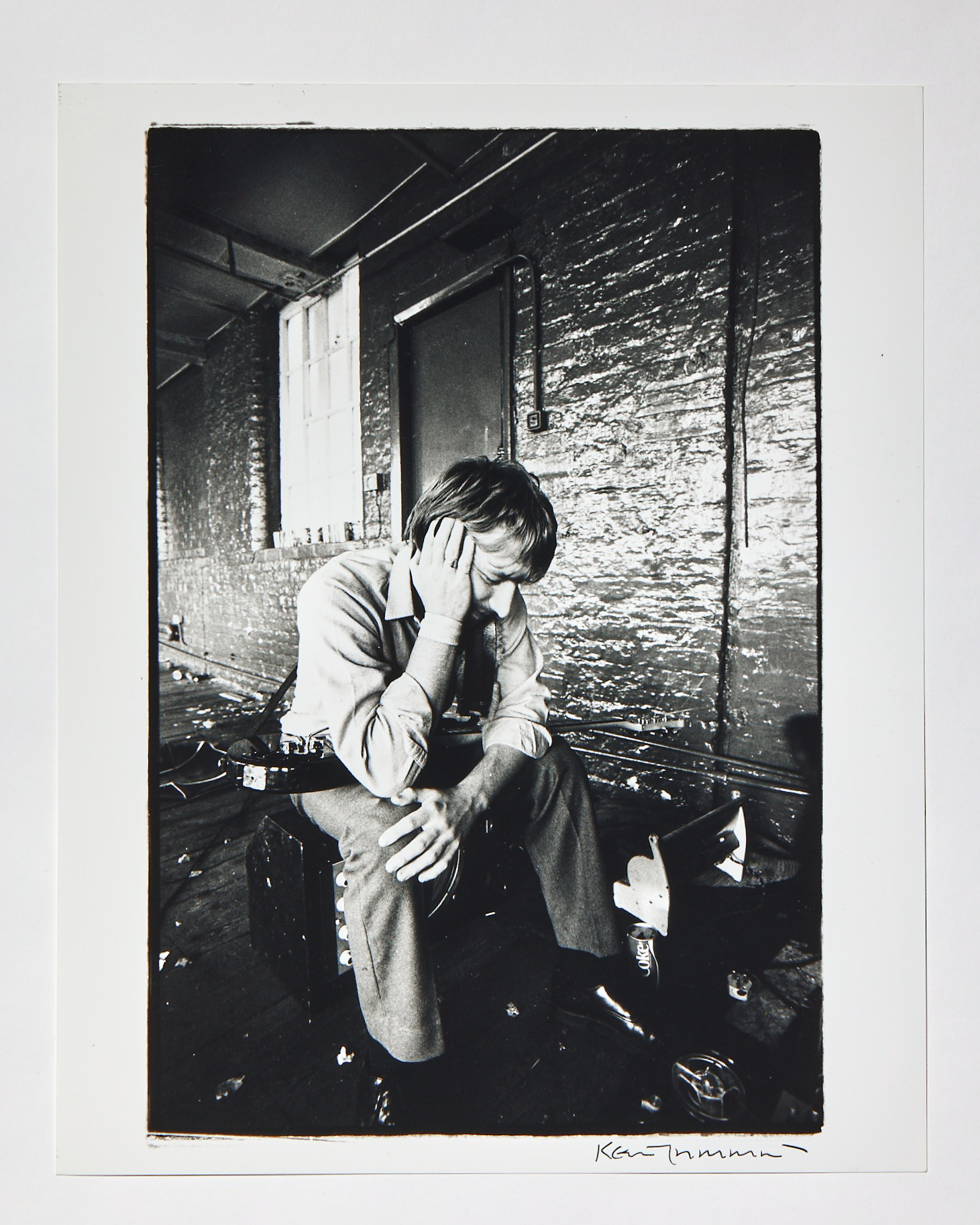a black and white portrait of peter hook of joy division outside by kevin cummins