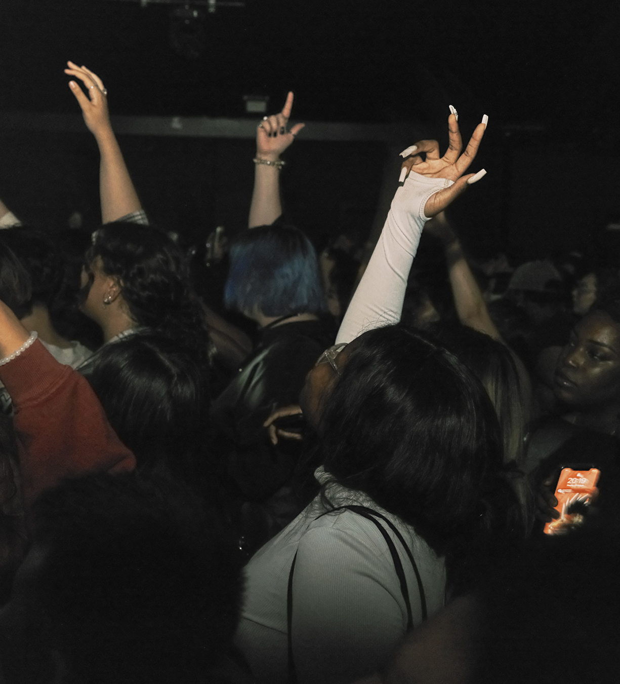 Clubbers with their hands in the air at Junny at the Garage, London in the summer of 2022