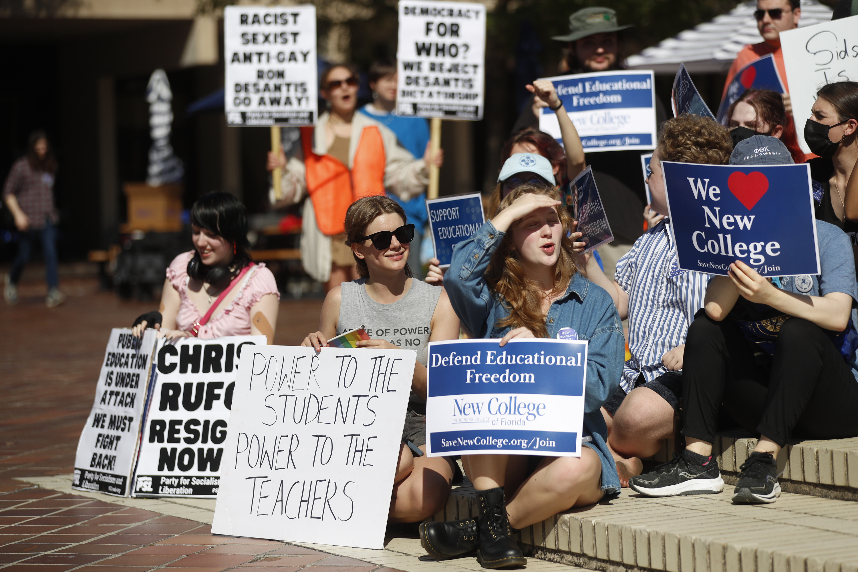 Students hold signs during a Defend New College protest in Sarasota, Florida, US, on Tuesday, Jan. 31, 2023. (Photo by Octavio Jones / Bloomberg via Getty Images)