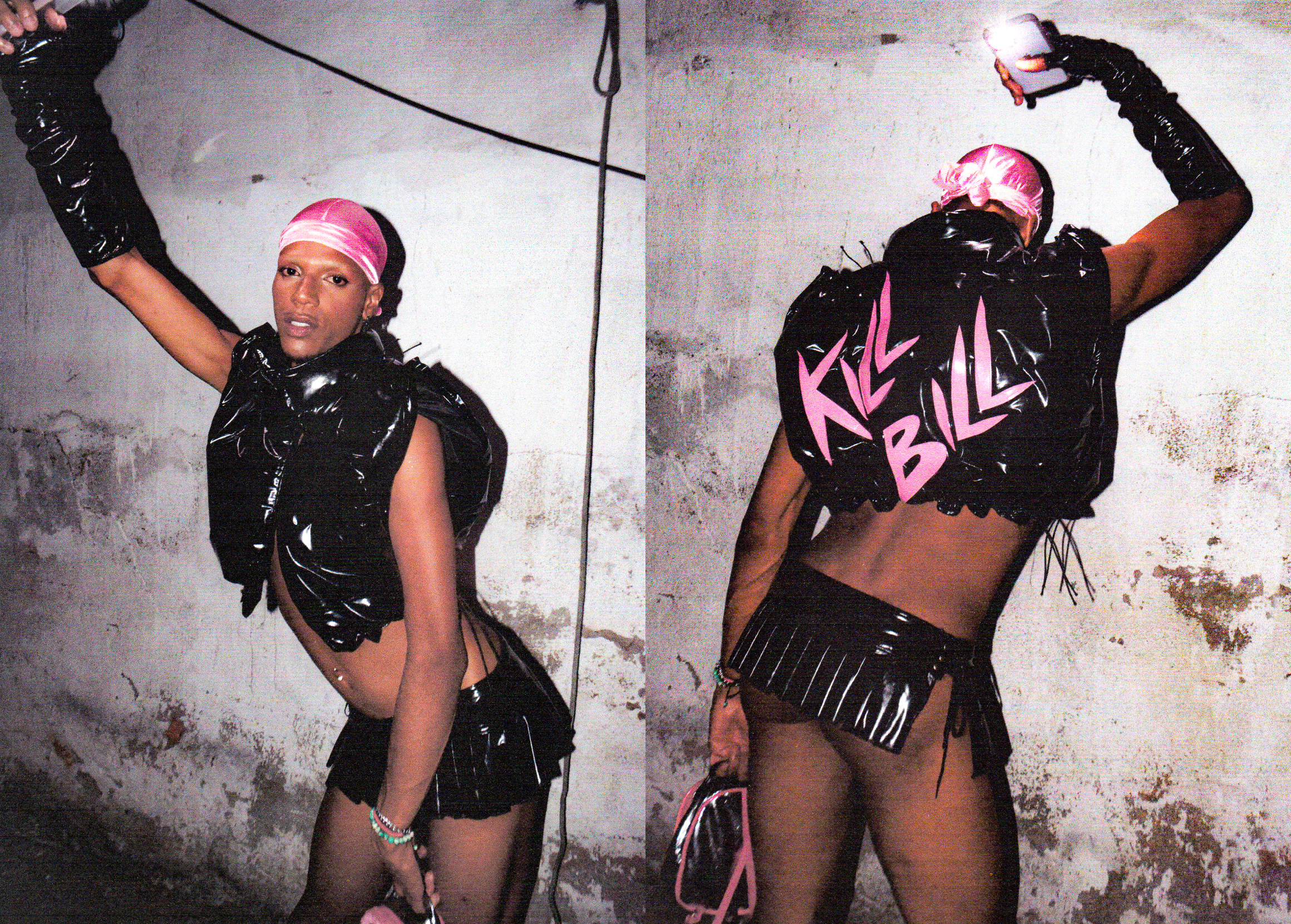 a performer wearing a shiny PVC skirt, cropped jacket and gloves combo with a pink durag