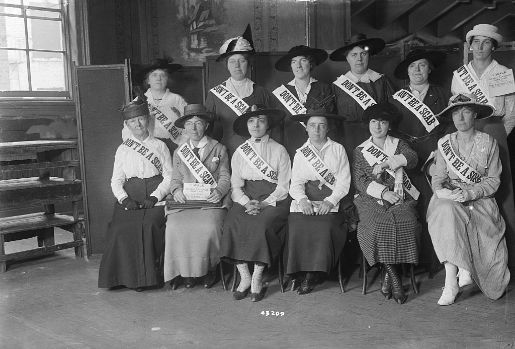 Pauline Newman (second from left, seated) at a meeting in aid of striking car men, 1916