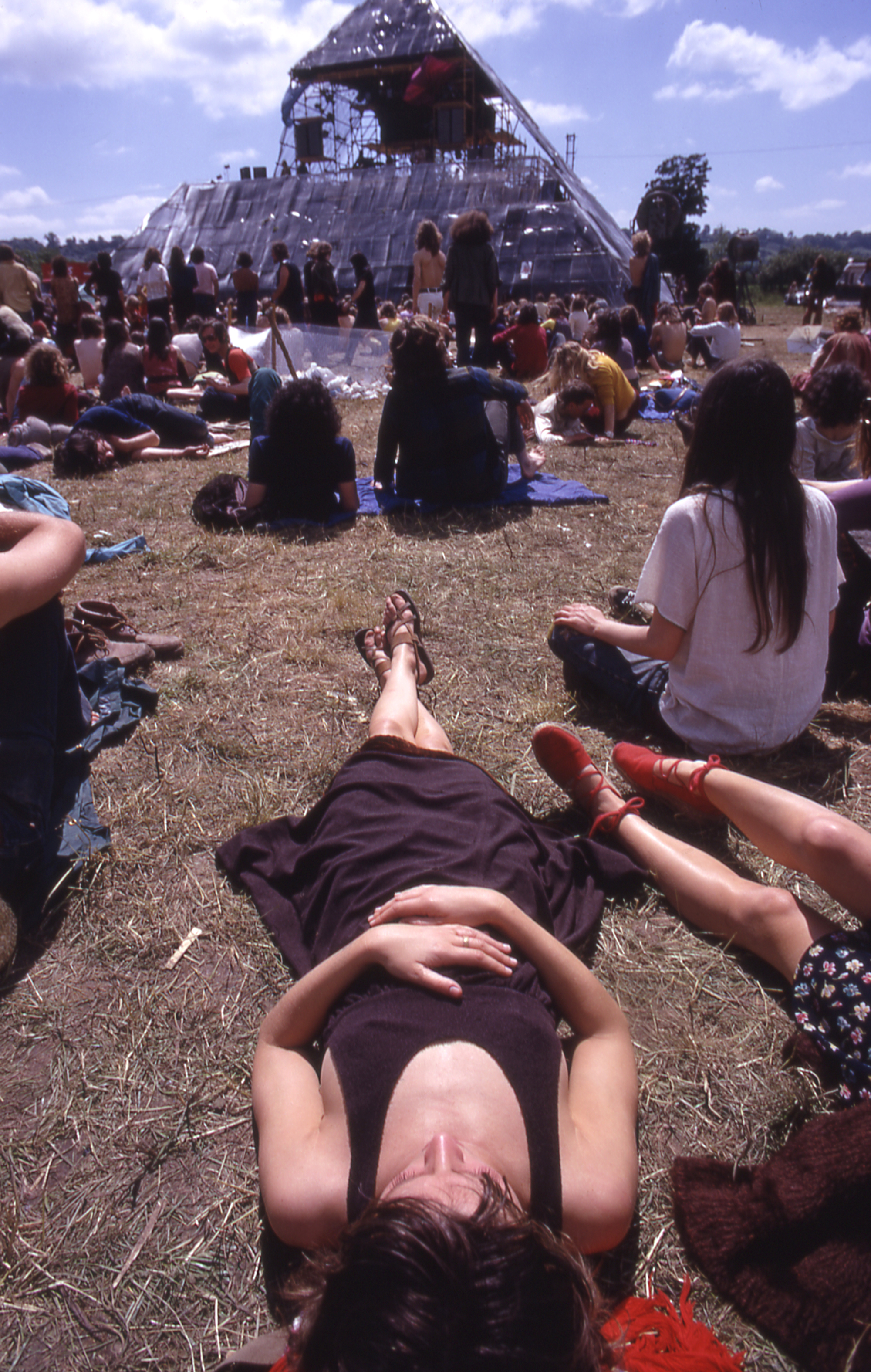 Julie Christie lying down in front of the pyramid stage at glastonbury 1971
