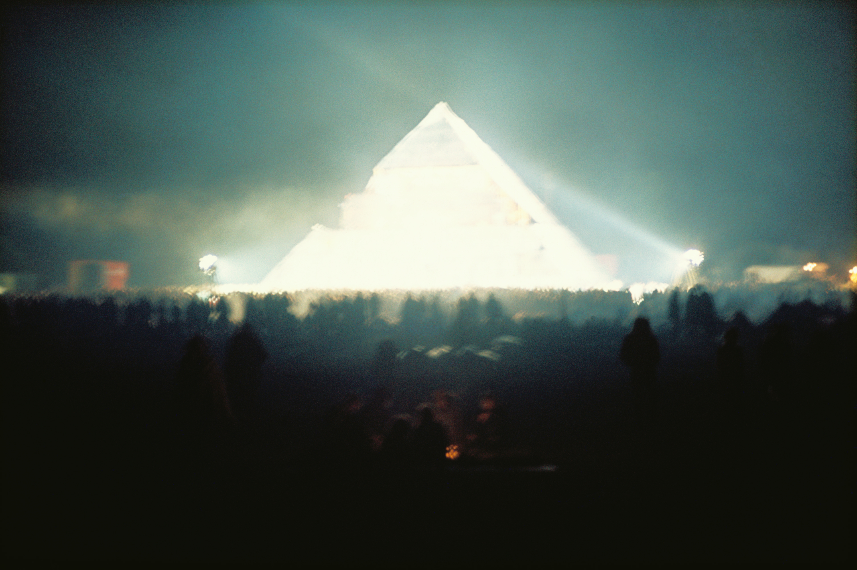 glastonbury's Pyramid Stage lit up at night at the festival in 1971