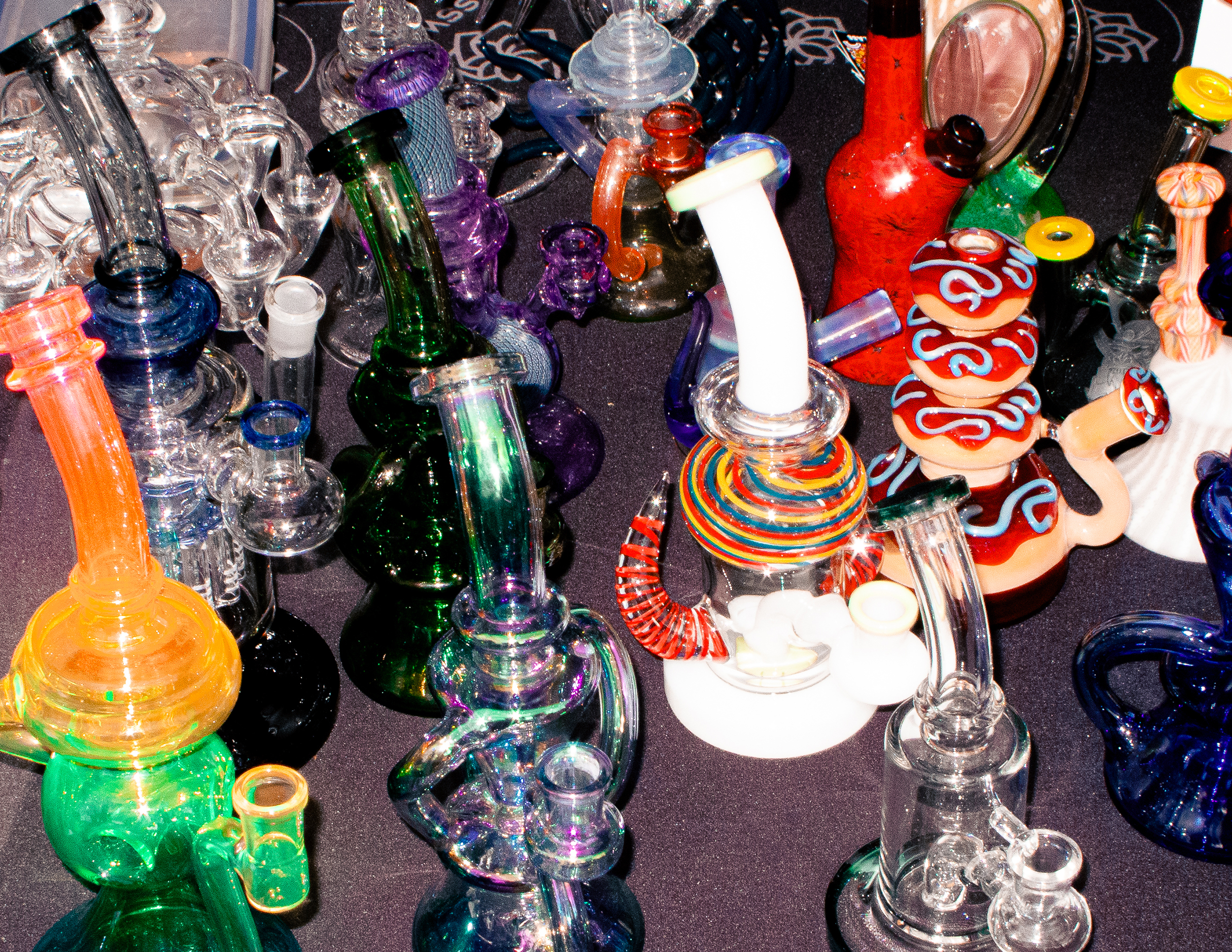 Lots of different coloured bongs at Product Earth UK cannabis event.