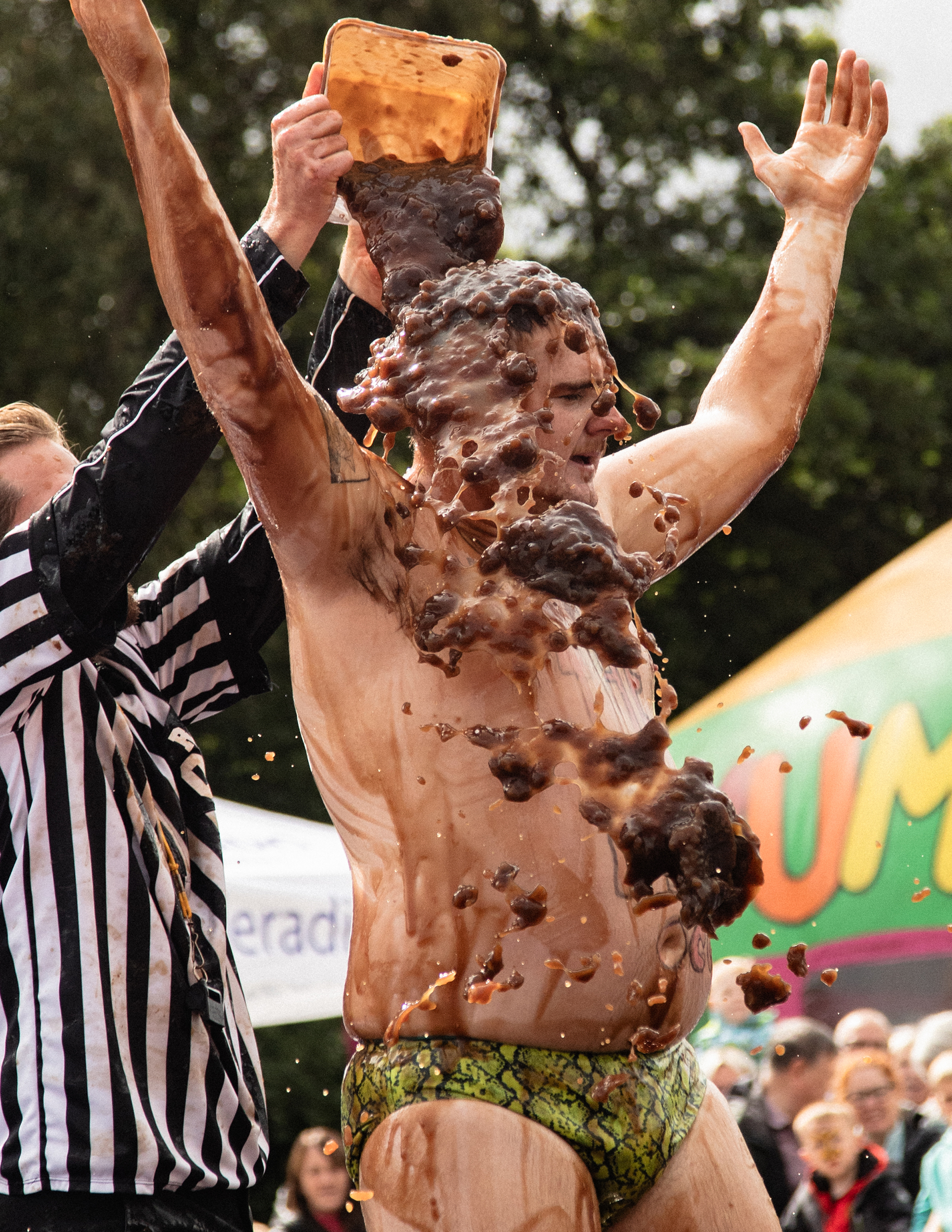 world gravy championships - a photo of a man in budgy smugglers getting covered in gravy.