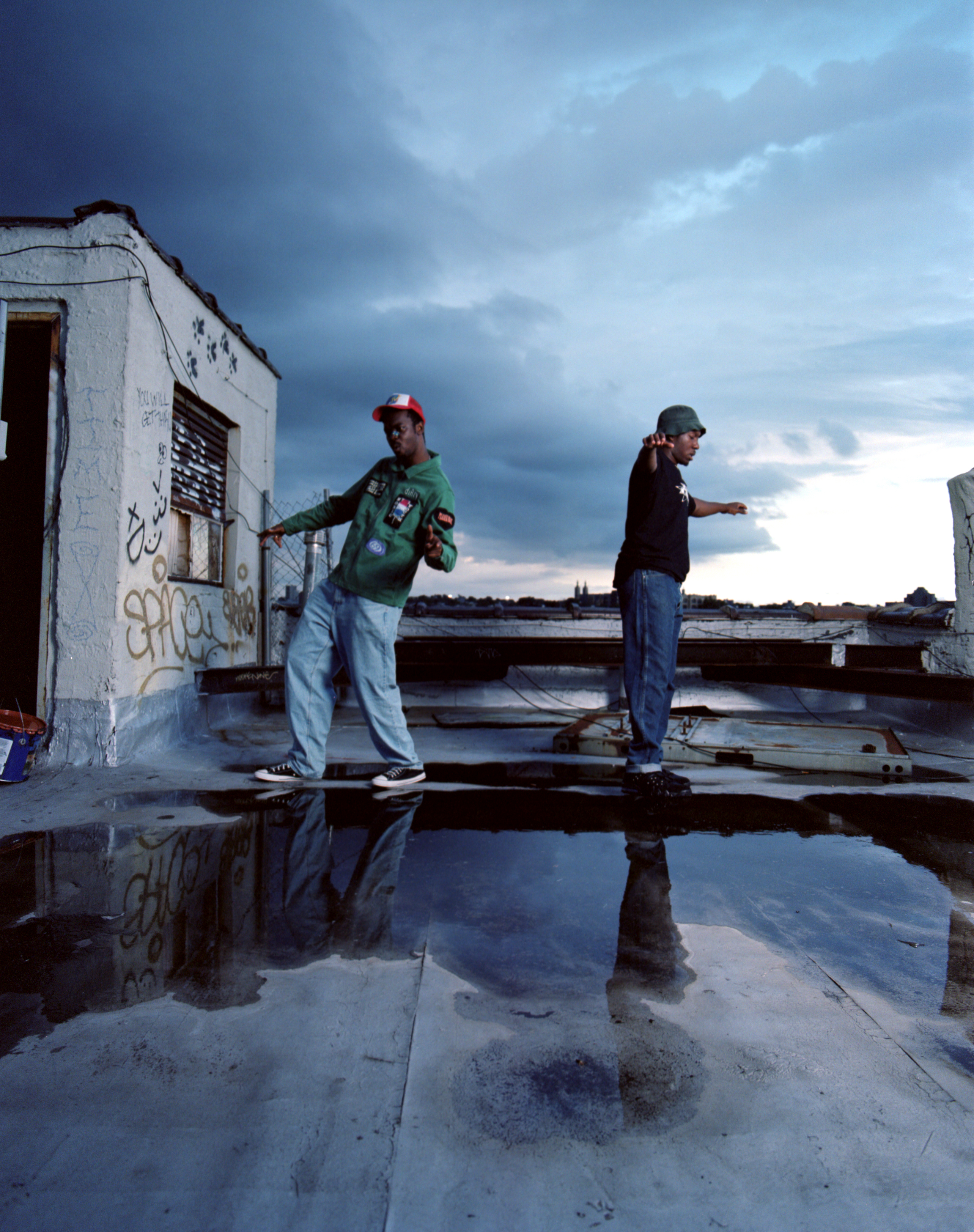 the rap duo paris texas standing on a roof
