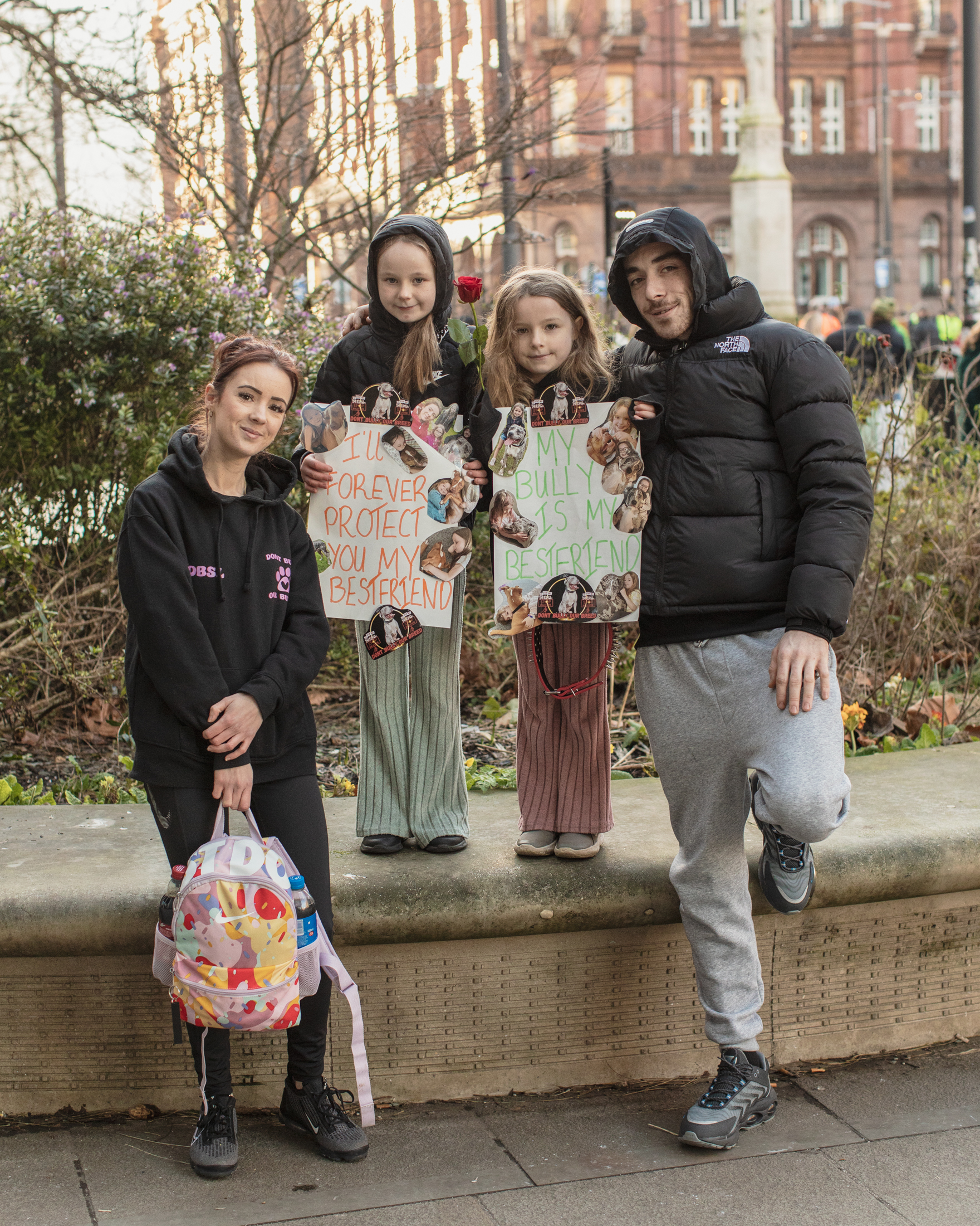 Manchester, UK: A family pose with two kids holding up pro-XL Bully signs