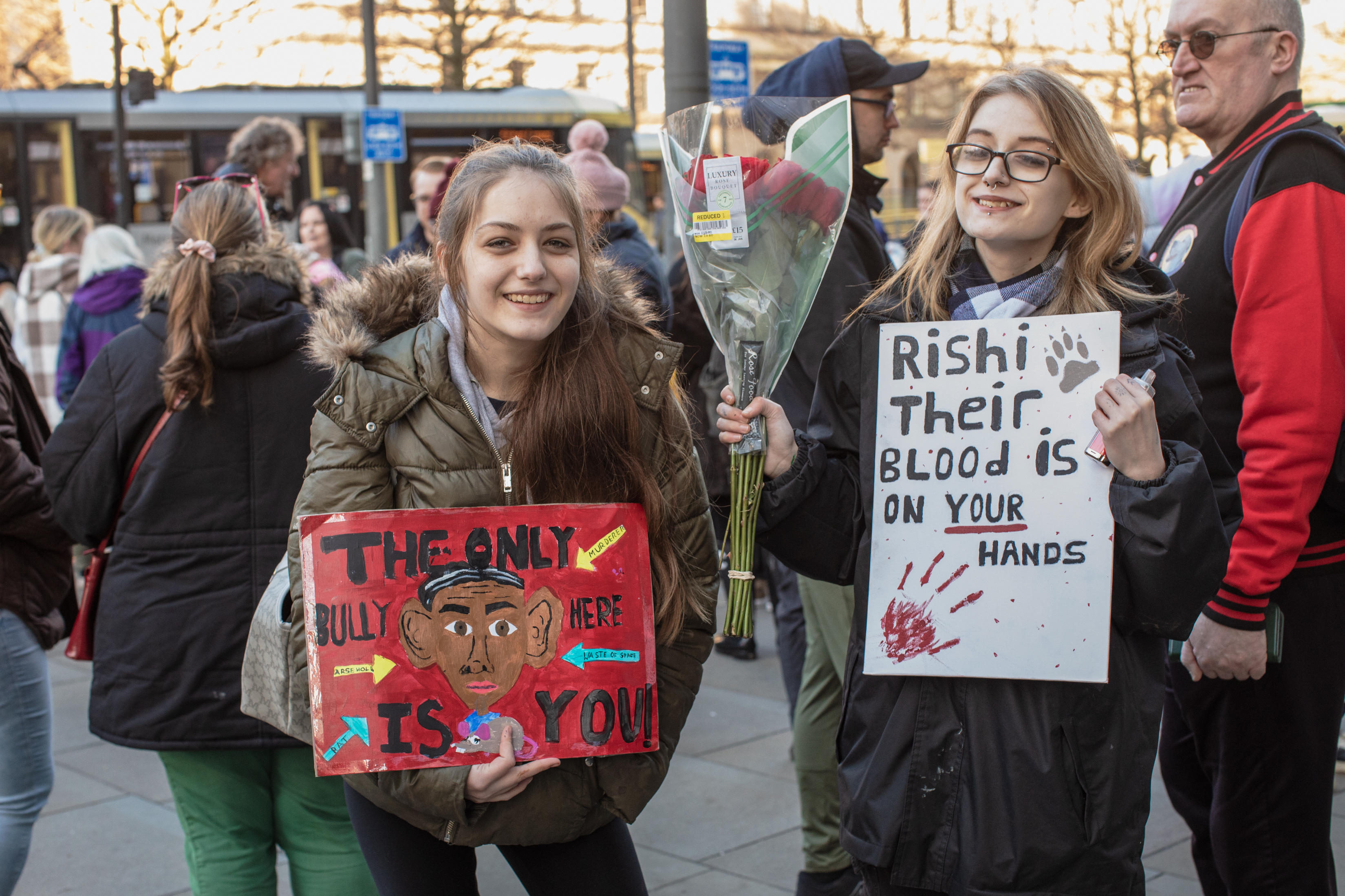 Manchester, UK: Two young girls holding up anti-Rishi Sunak signs at an XL Bully protest