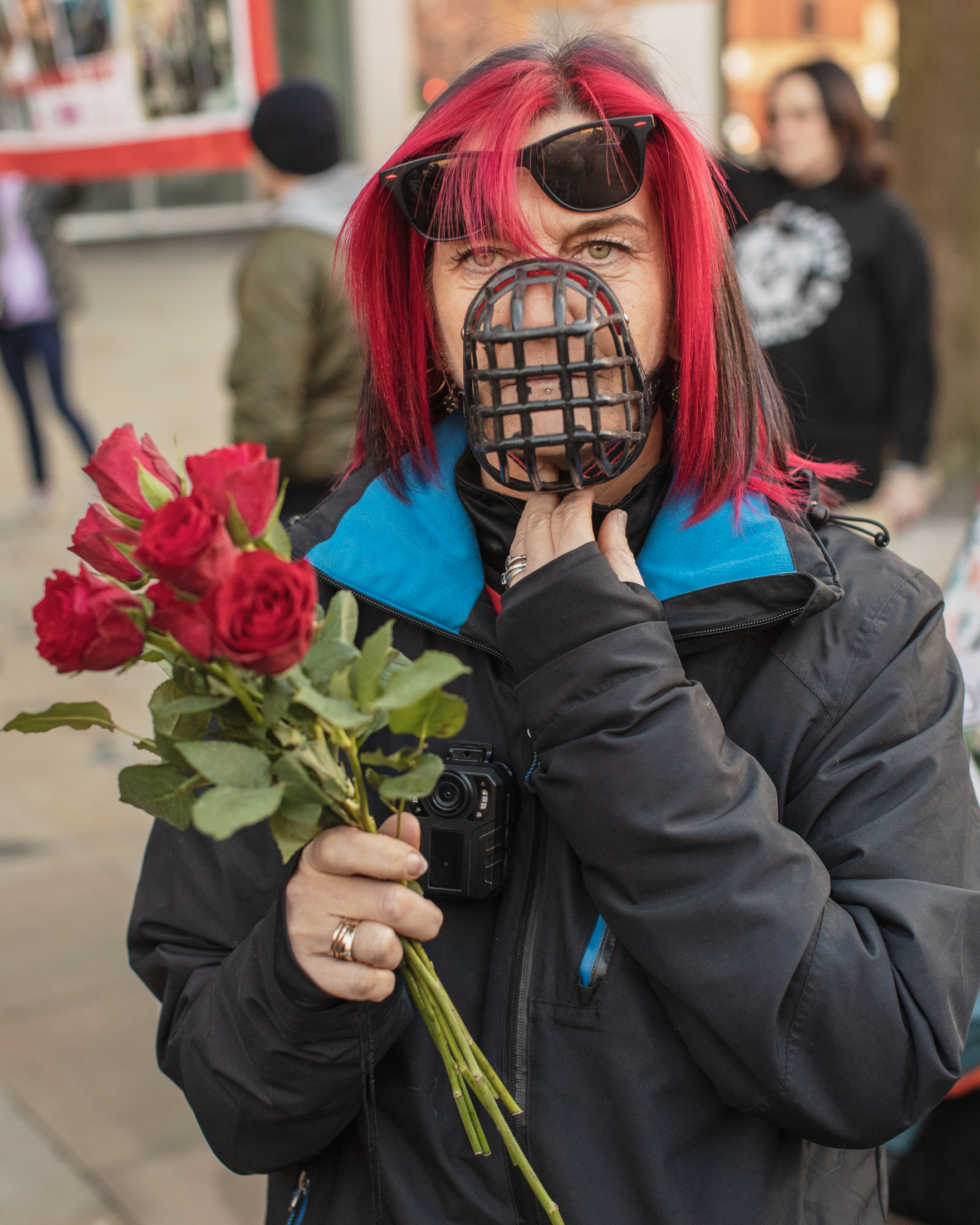 Manchester, UK: Woman at an XL Bully protest wears a muzzle