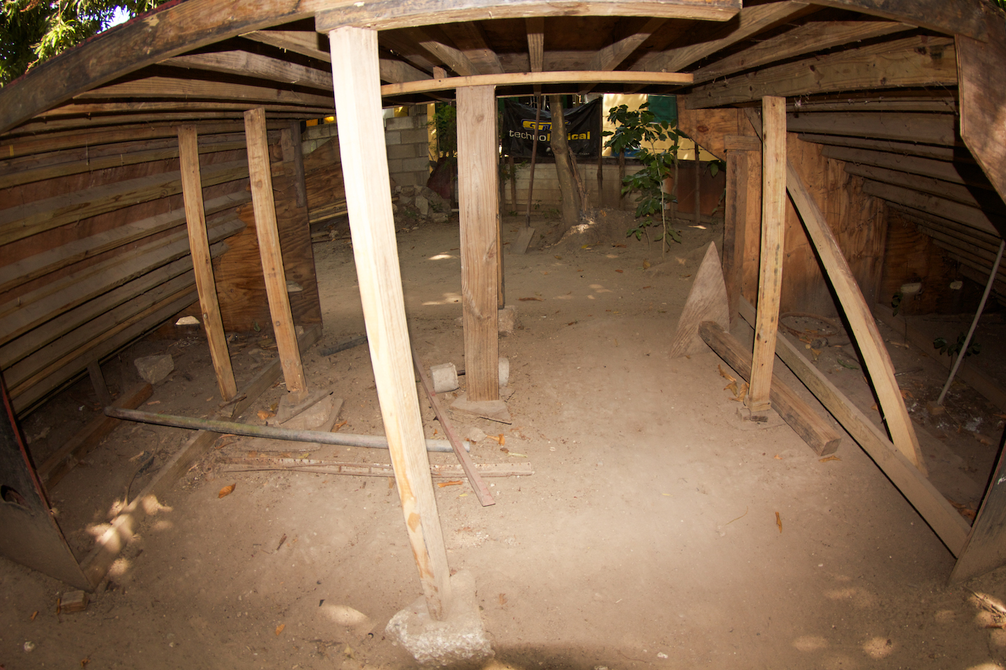 A photo of the wooden joists holding up a DIY ramp for BMX riders.