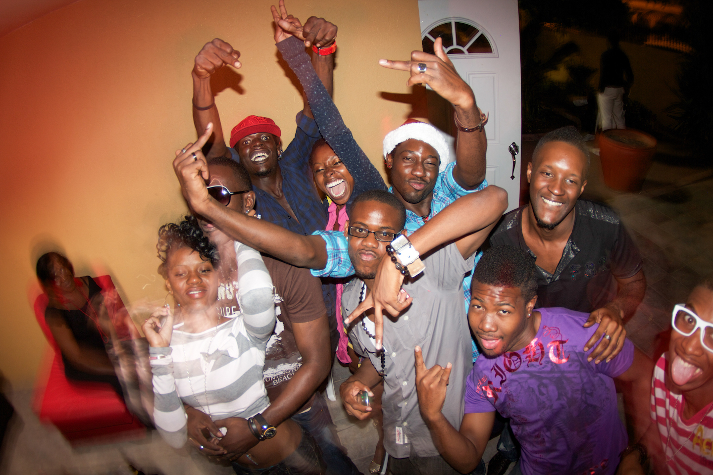 A group of young people pose for the camera at a BMX rider party.