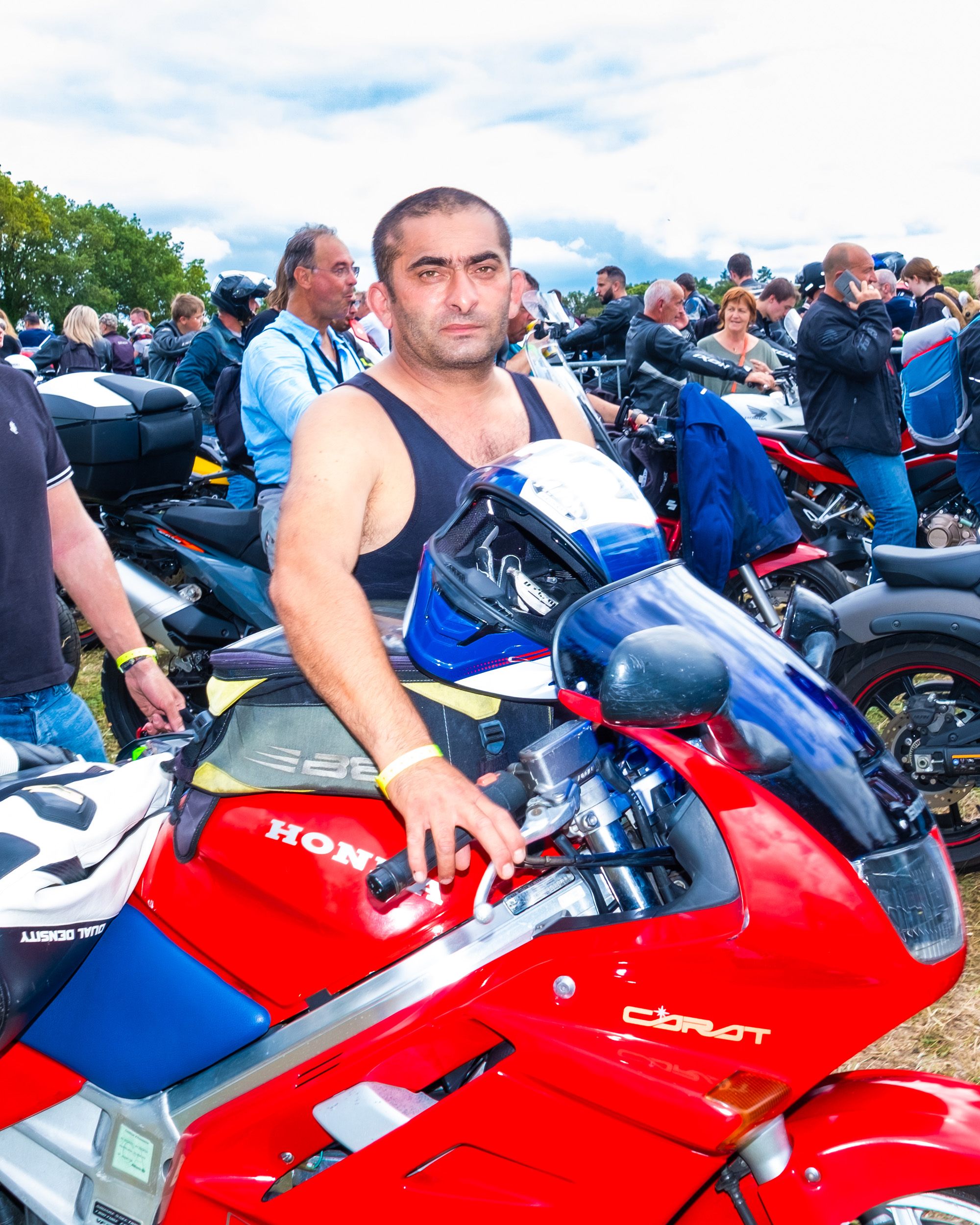 priest bless motorcycle rider at Le Pardon des Motards pilgrimage in porcaro brittany france