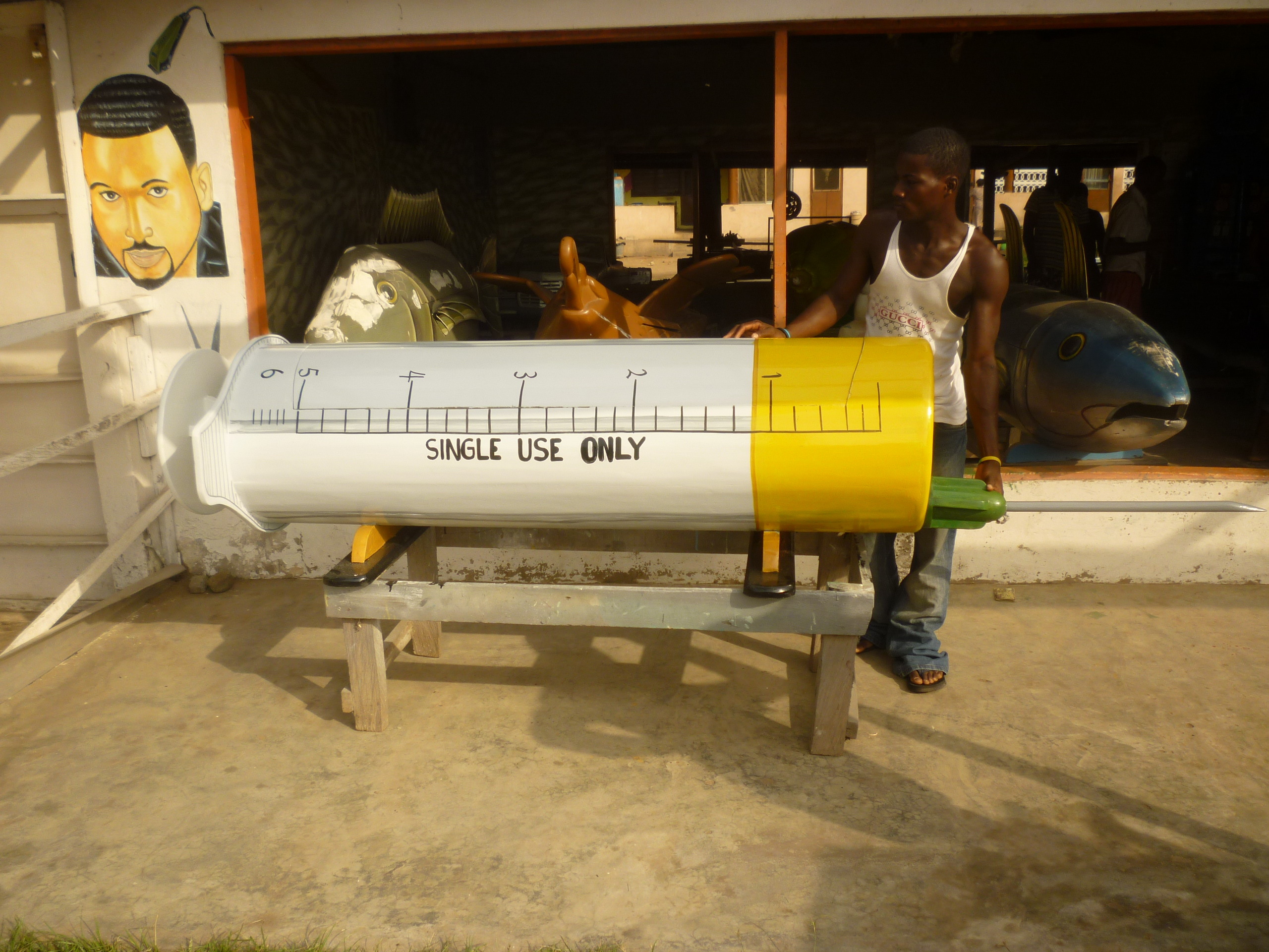 A coffin in the shape of a syringe.