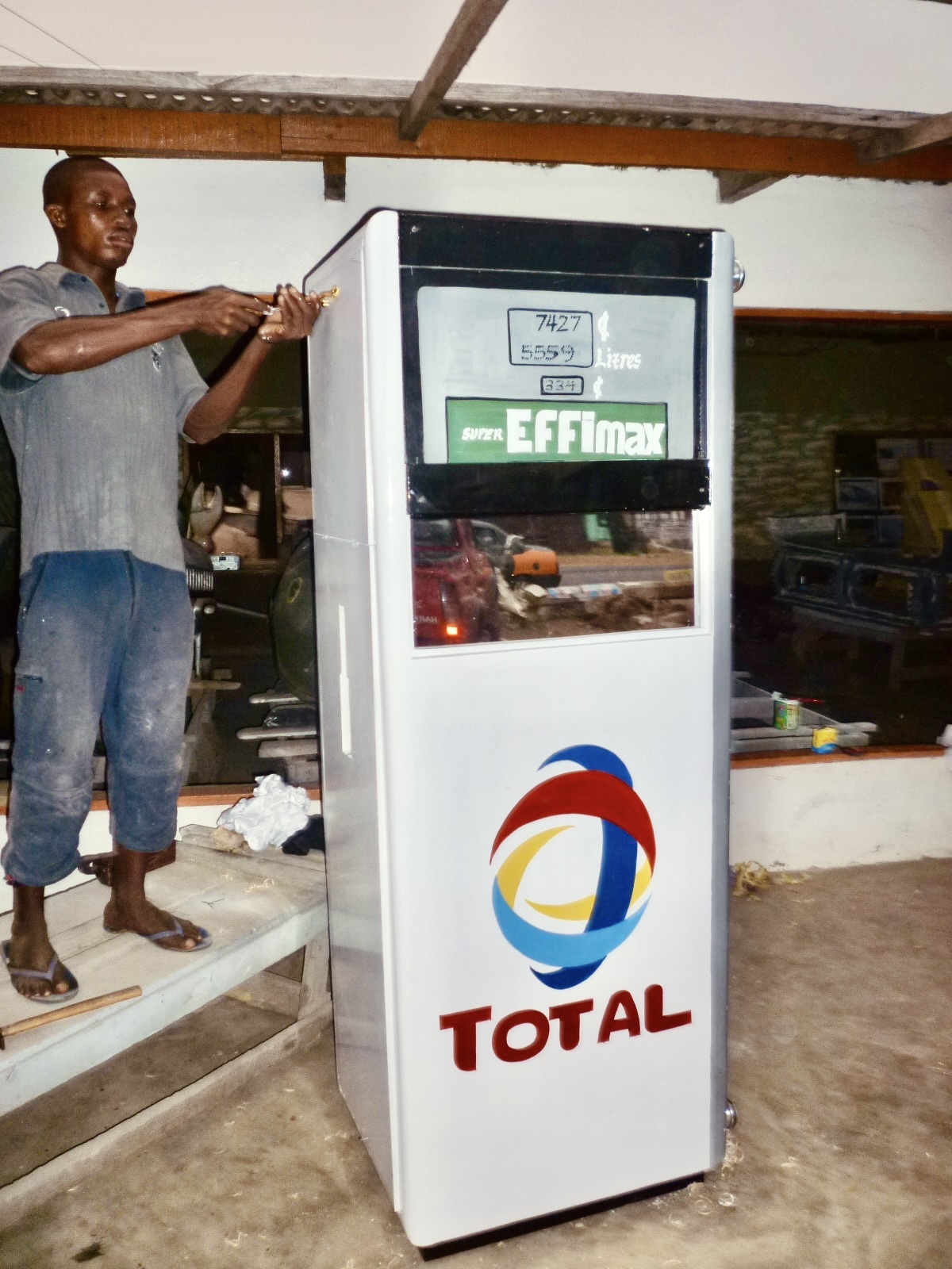 A coffin in the shape of a petrol pump.