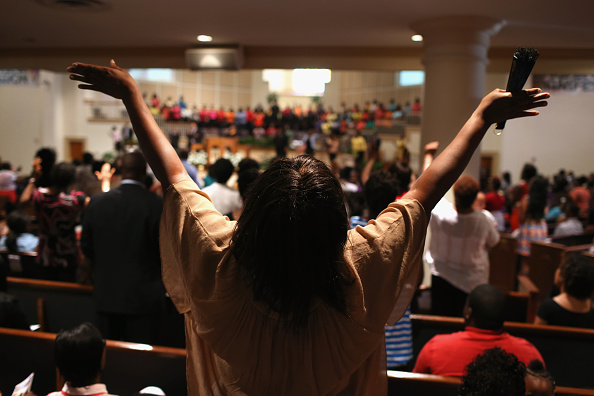 black people praying in church