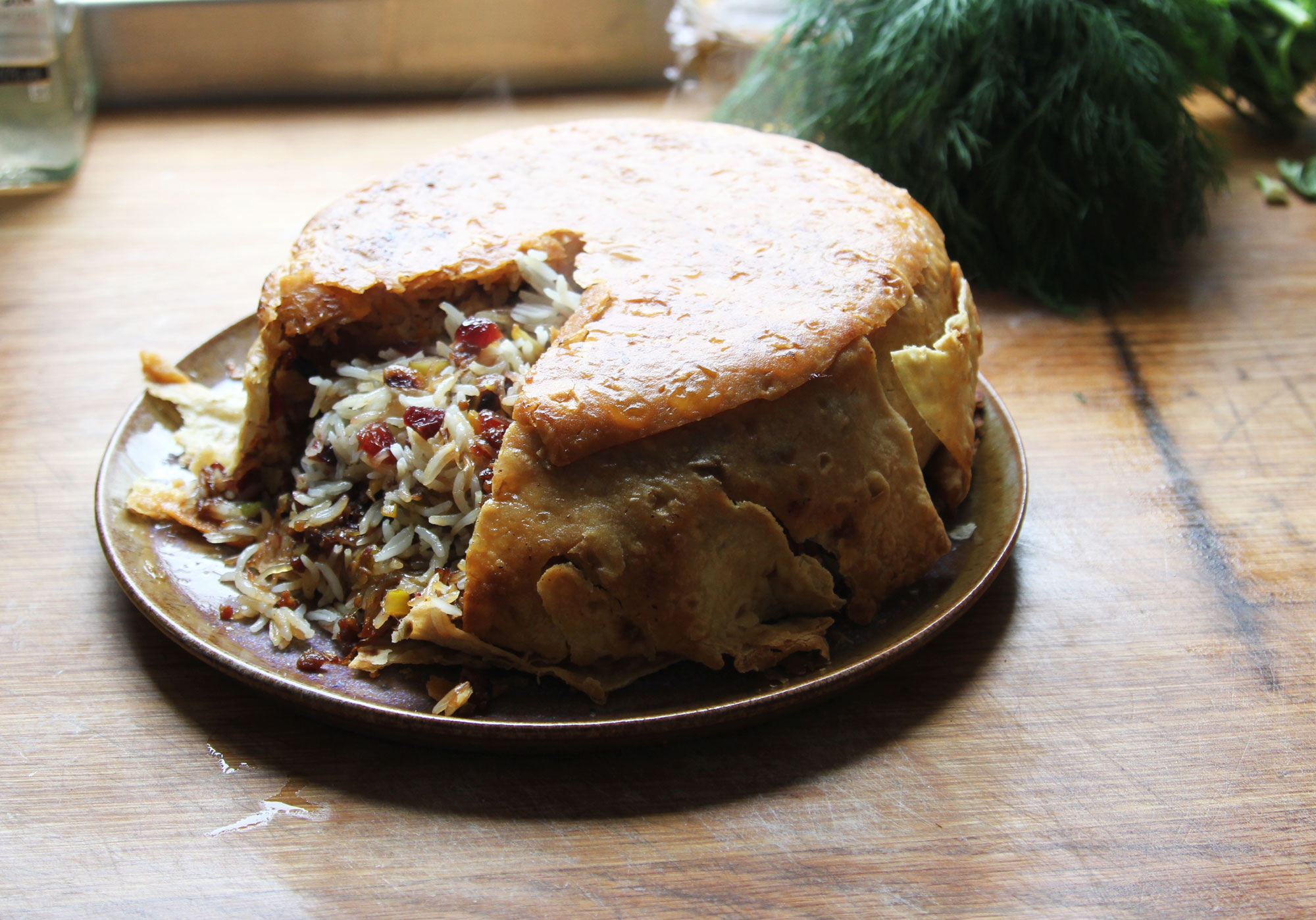 This Saffron Rice Is Packed with Chicken and Wrapped in Buttery Flatbread