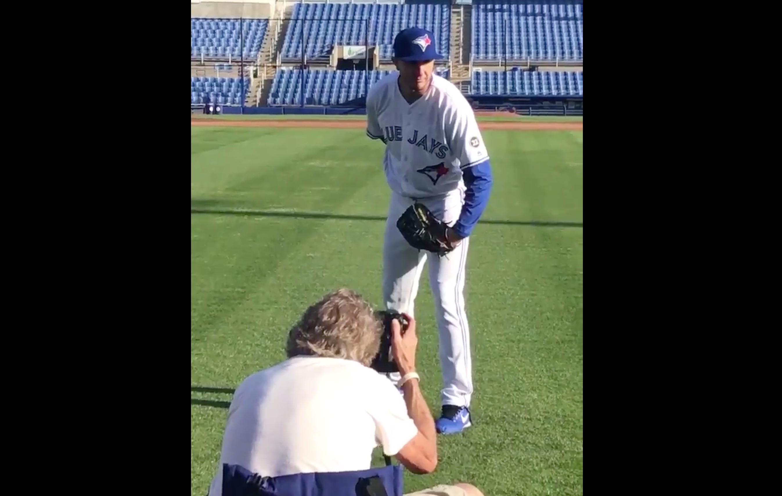 Troy Tulowitzki poses as a pitcher on Blue Jays' photo day