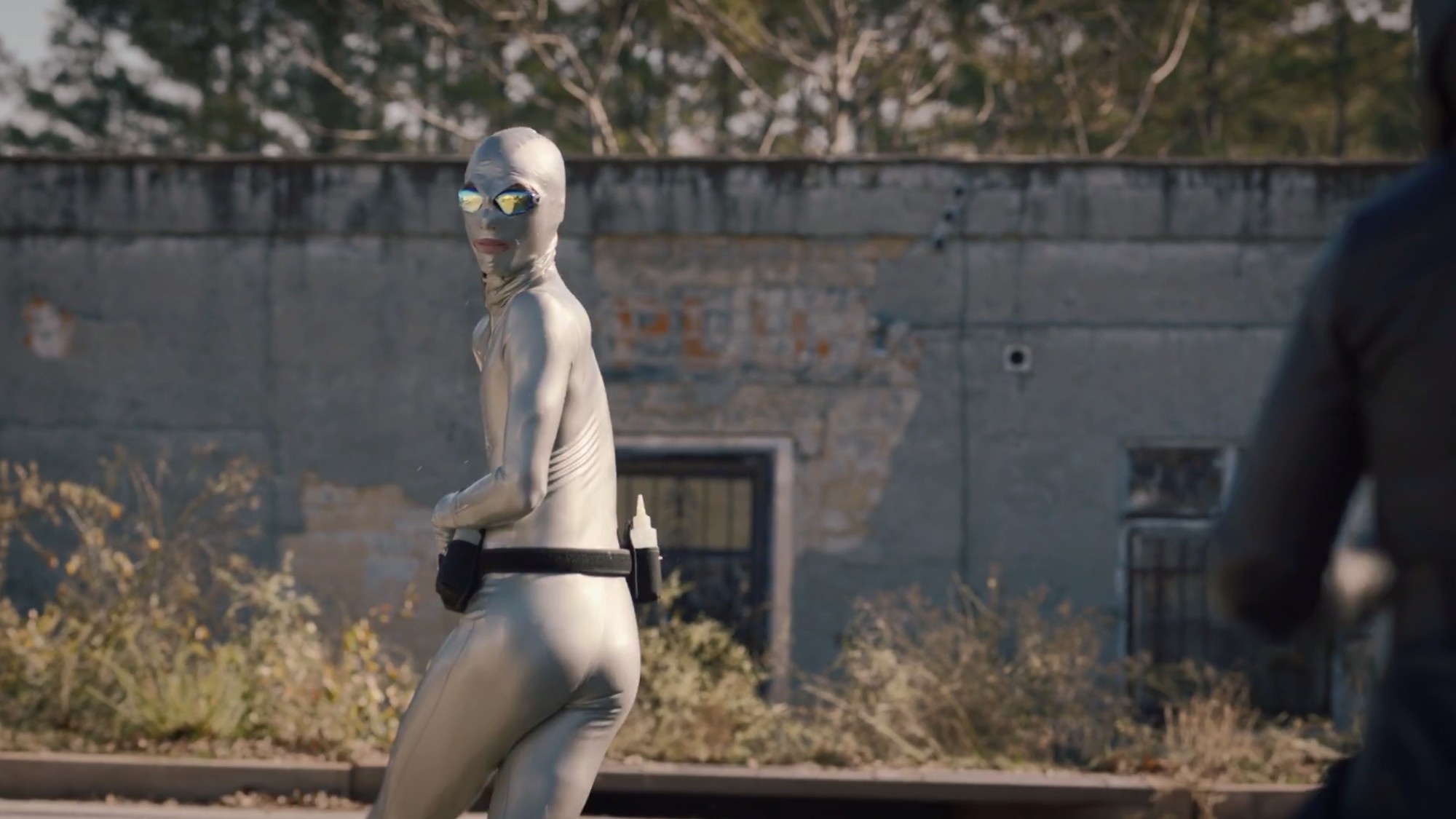 HBO Watchmen's Lube Man wearing Vex Latex Catsuit and Moderne Hood in Silver
