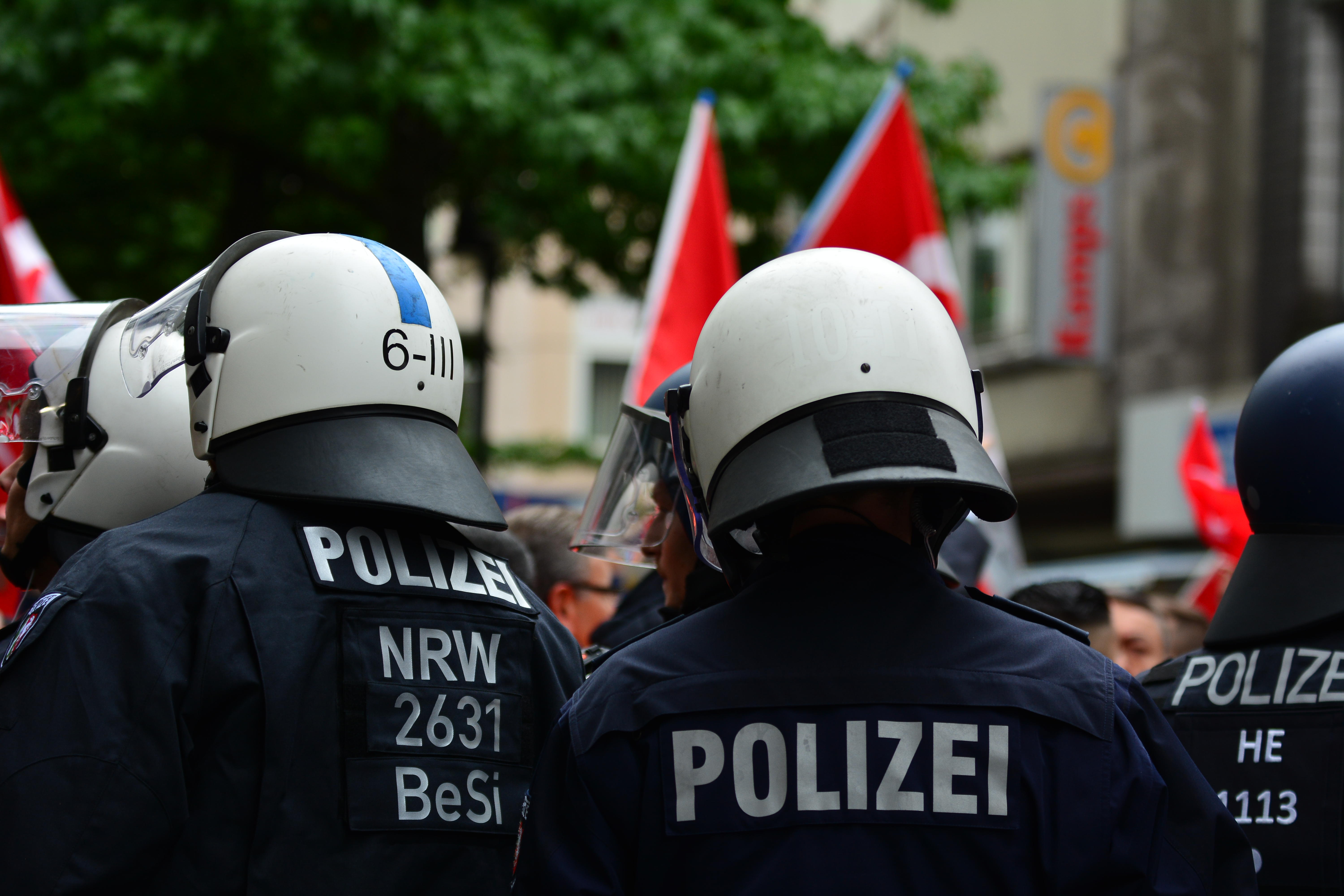 Unrecognizable German Polizei Police Officers Checks People At The