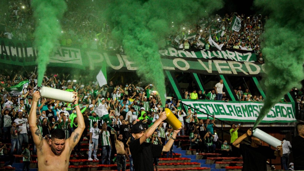 Fans of Atletico Nacional celebrate at the end of a second leg